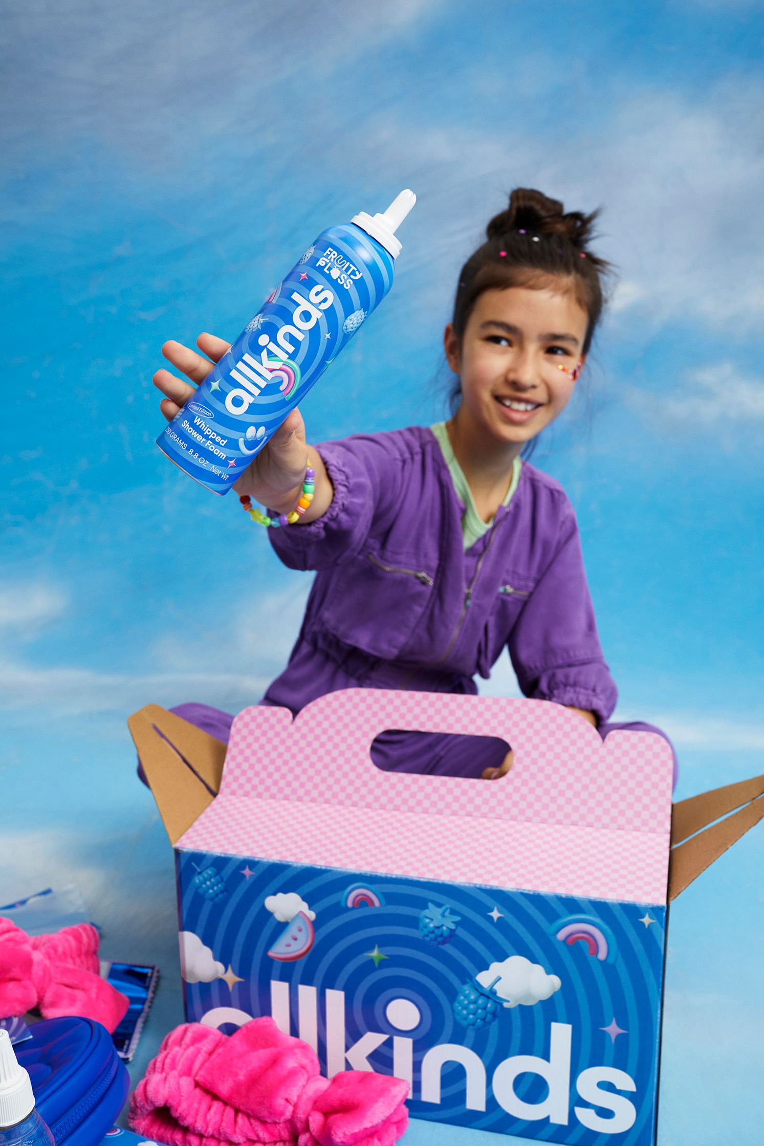 Girl holiding up Whipped Shower Foam
