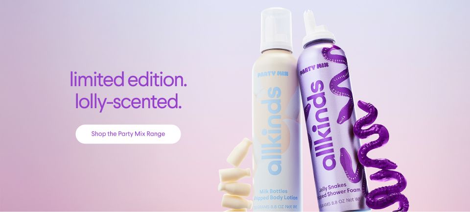a bottle of lotion and a bottle of mousse are sitting next to each other on a table .
