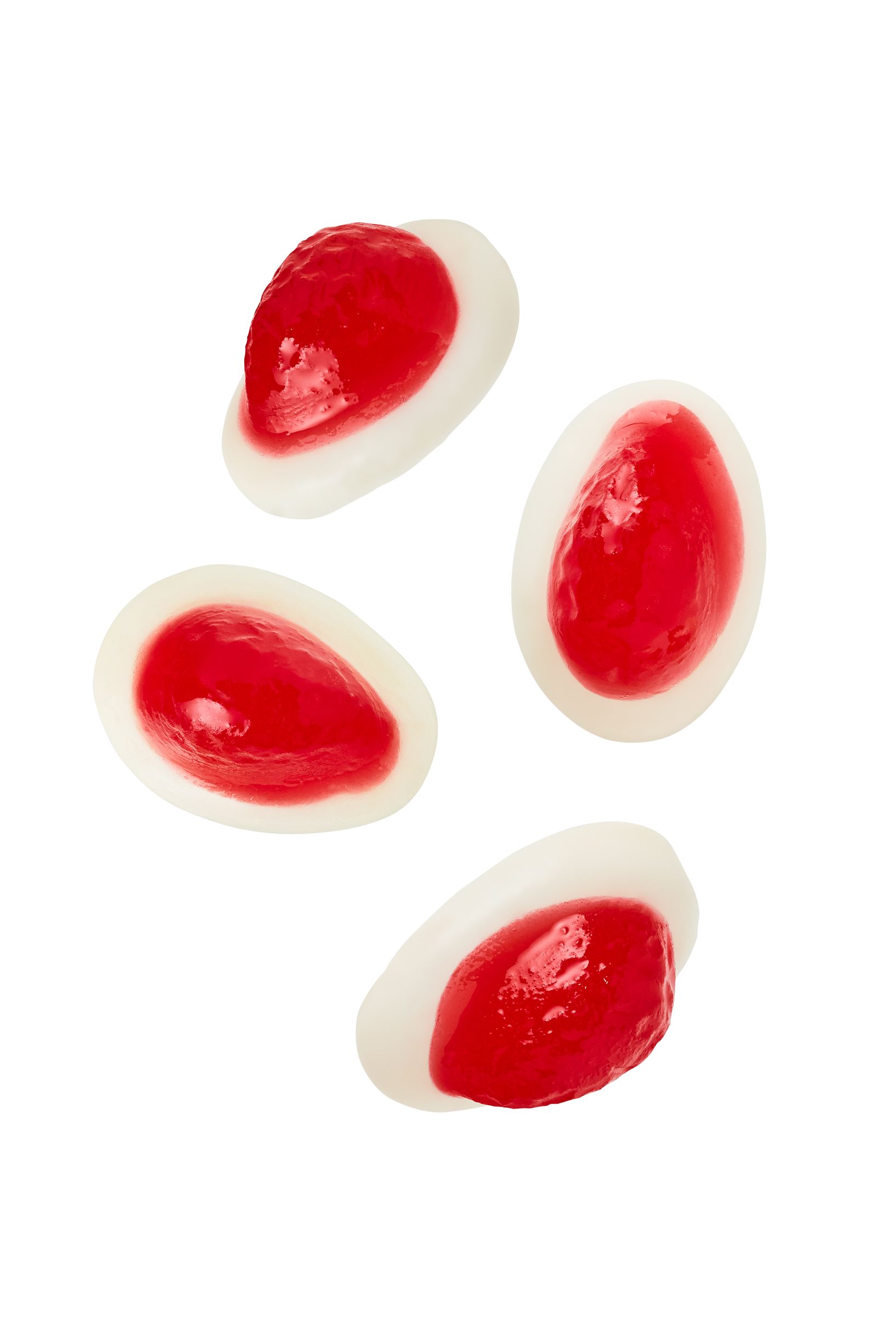 a group of red and white jelly beans on a white background