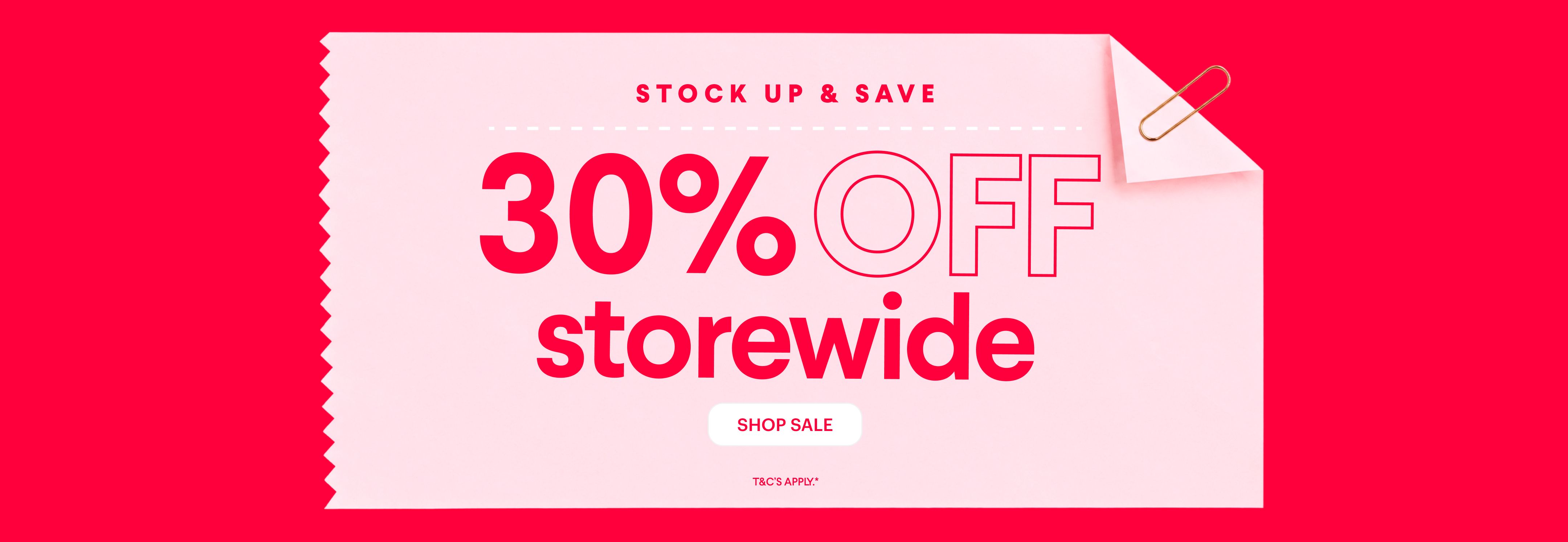 A pink coupon with "STOCK UP & SAVE", "30% OFF storewide", and "SHOP SALE" text on a red background, secured by a paperclip.