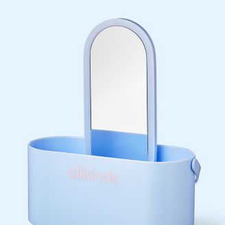 Light blue oval caddy with an upright mirror and pink "allkinds" logo.