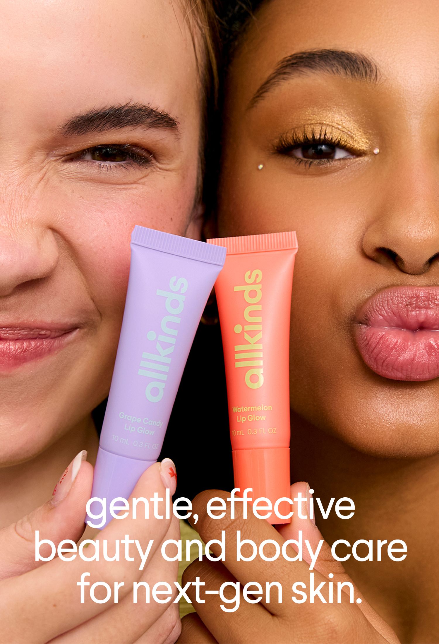 Close-up of two diverse individuals holding purple Grape Candy and orange Watermelon allkinds lip glow tubes. One smiles, the other pouts with golden eyeshadow. Text: 'gentle, effective beauty and body care for next-gen skin.'