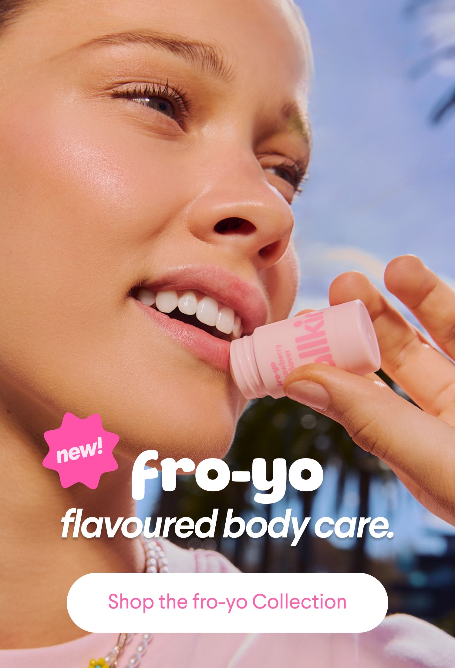 A woman applies a pink fro-yo lip product. Text: "new! fro-yo flavoured body care."