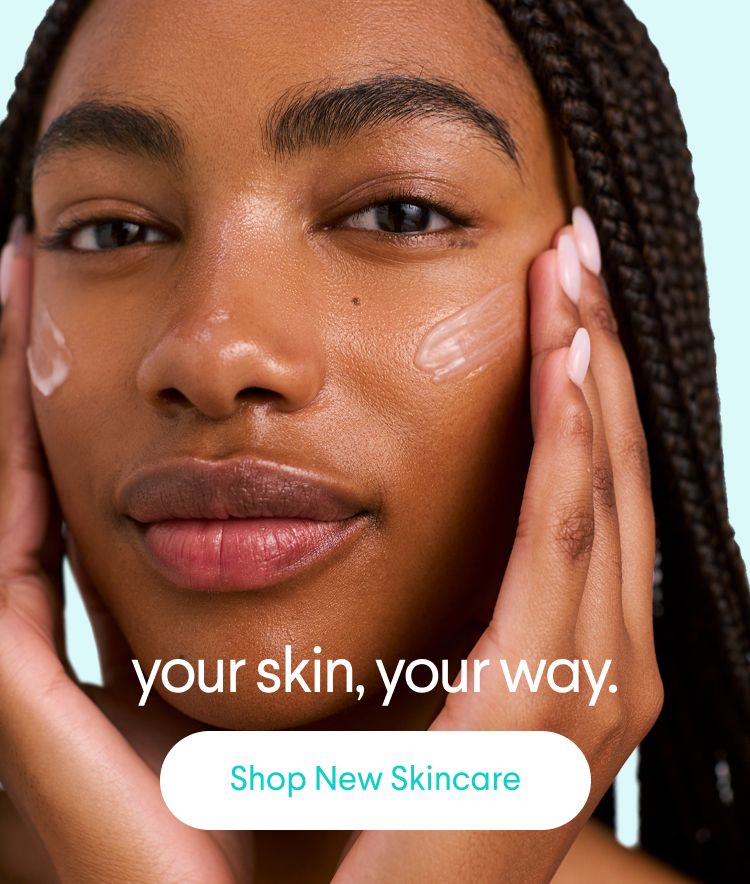 Close-up of a person with dark skin, with skincare product on their cheeks and hands on their face. Text: "your skin, your way. Shop New Skincare."