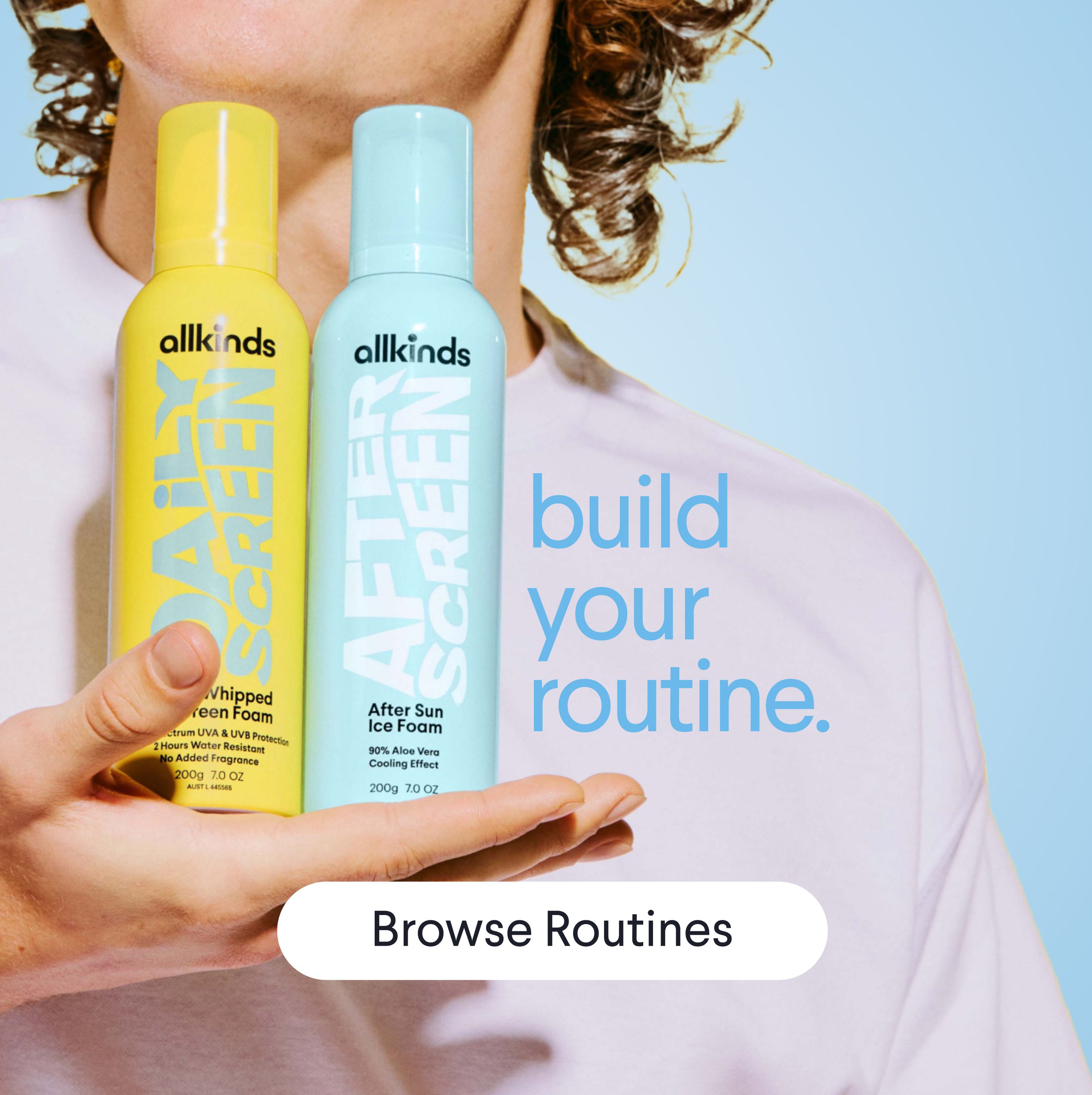 a man is holding two bottles of after sun ice foam in his hand .