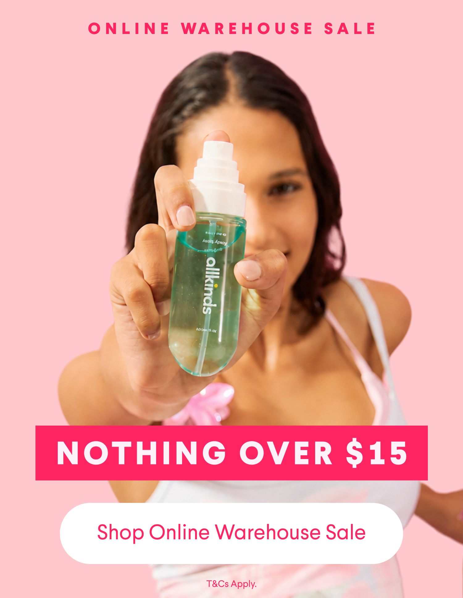 Ad for an allkinds online warehouse sale: A smiling woman holds a body spray bottle, with text reading 'ONLINE WAREHOUSE SALE', 'NOTHING OVER $15', and 'Shop Online Warehouse Sale'.