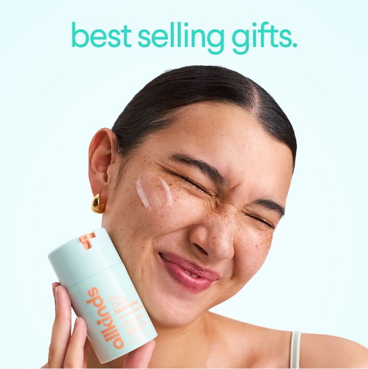 Smiling woman with moisturizer on her cheek holds an allkinds Cloud Cloud Moisturiser. Text: "best selling gifts."