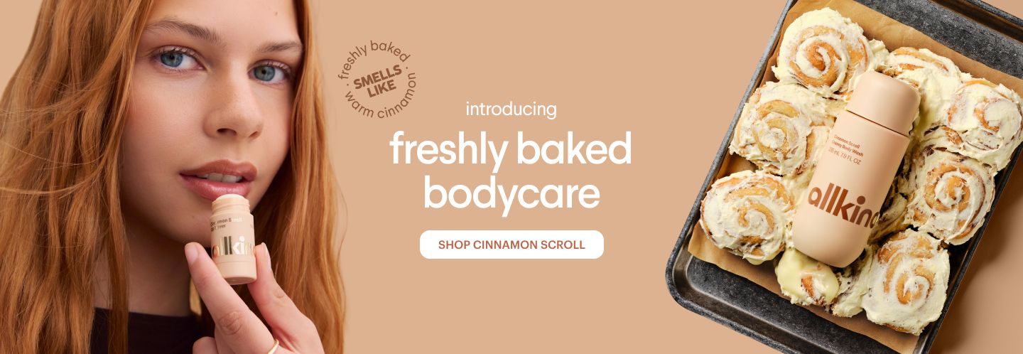 Allkind ad for cinnamon-scented "freshly baked bodycare", showing a woman applying a stick product and a bodycare stick in a tray of cinnamon rolls.
