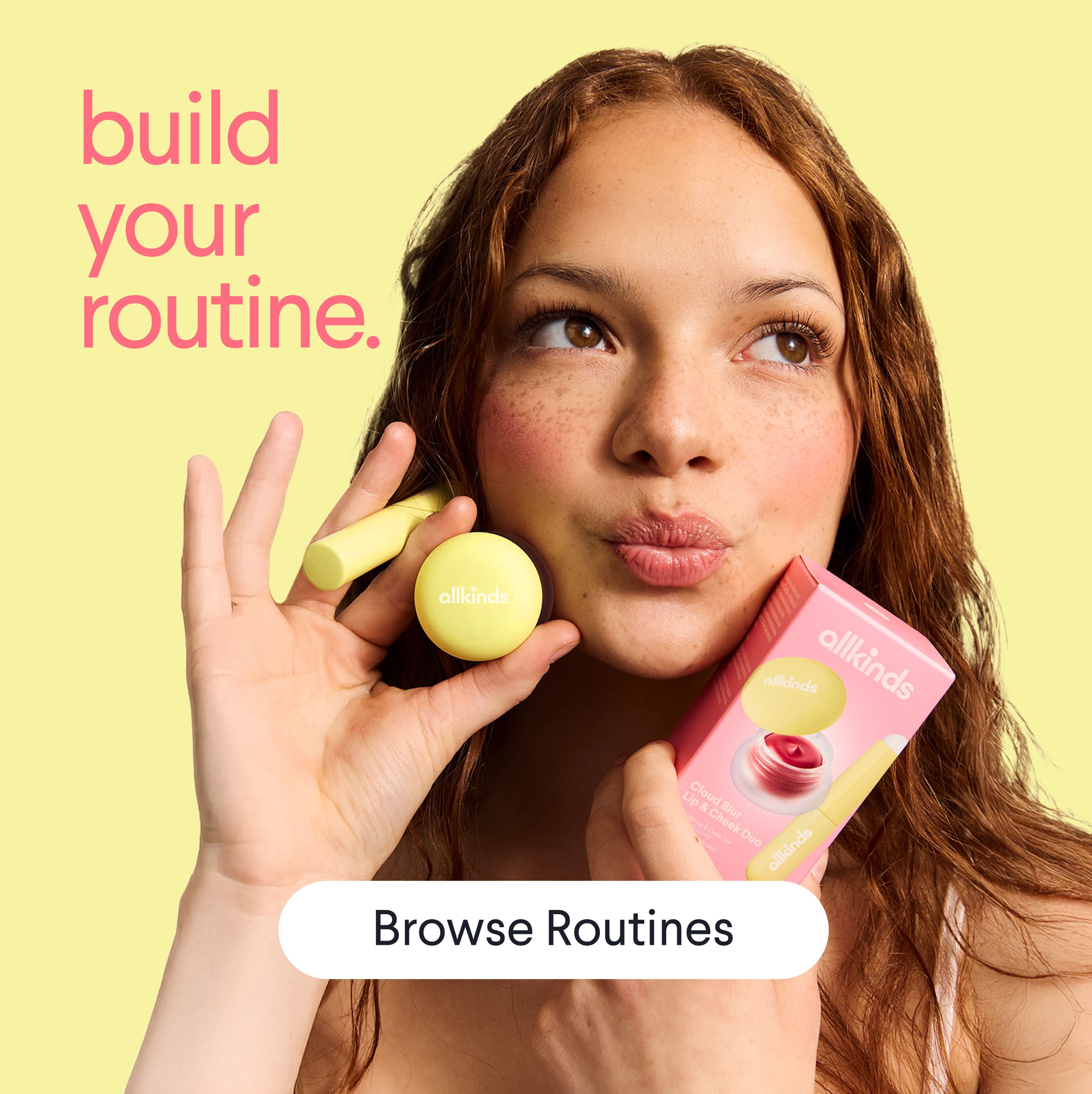 a woman is holding a lip balm and a box of lip balm .