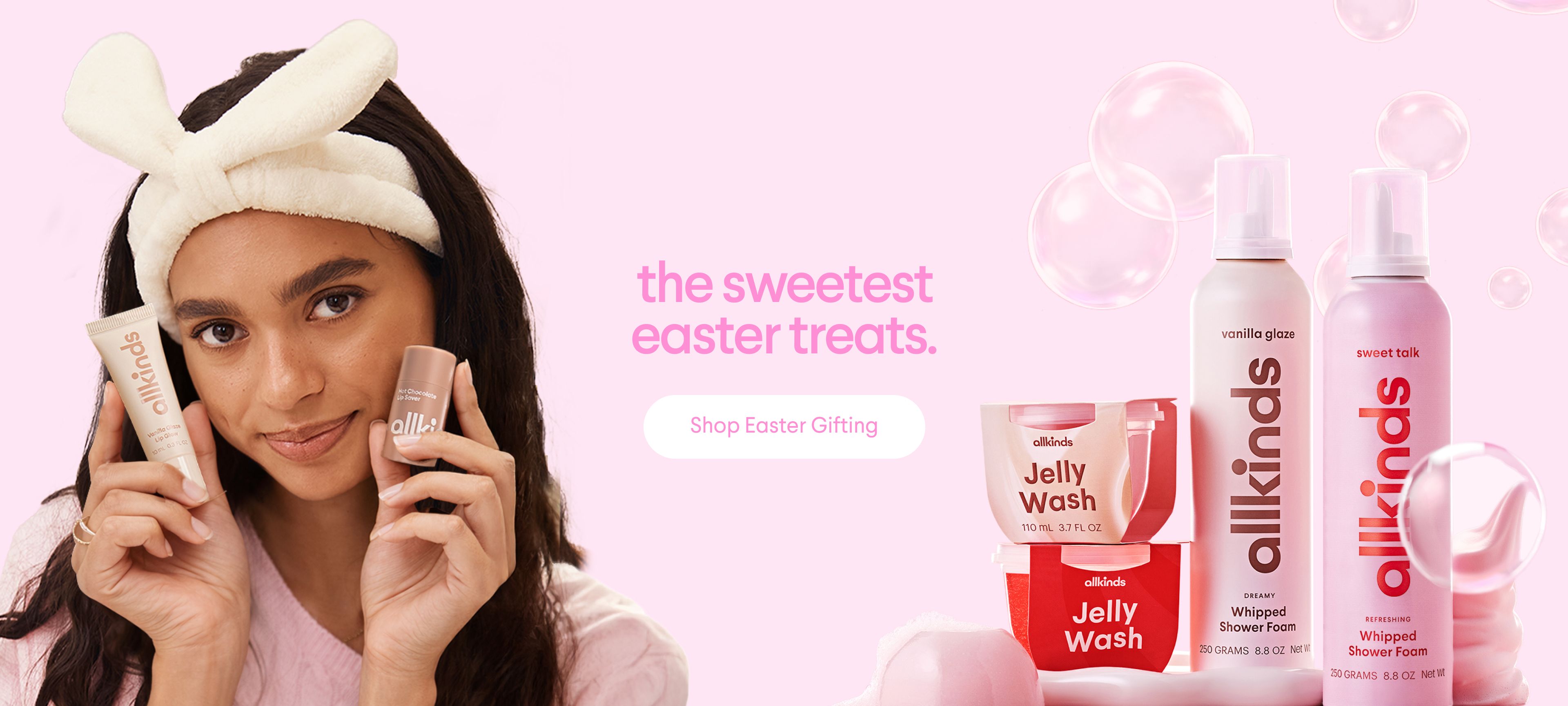 A woman wearing bunny ears holds two allkinds products, with more allkinds bath products and the text "the sweetest easter treats" on a pink background.
