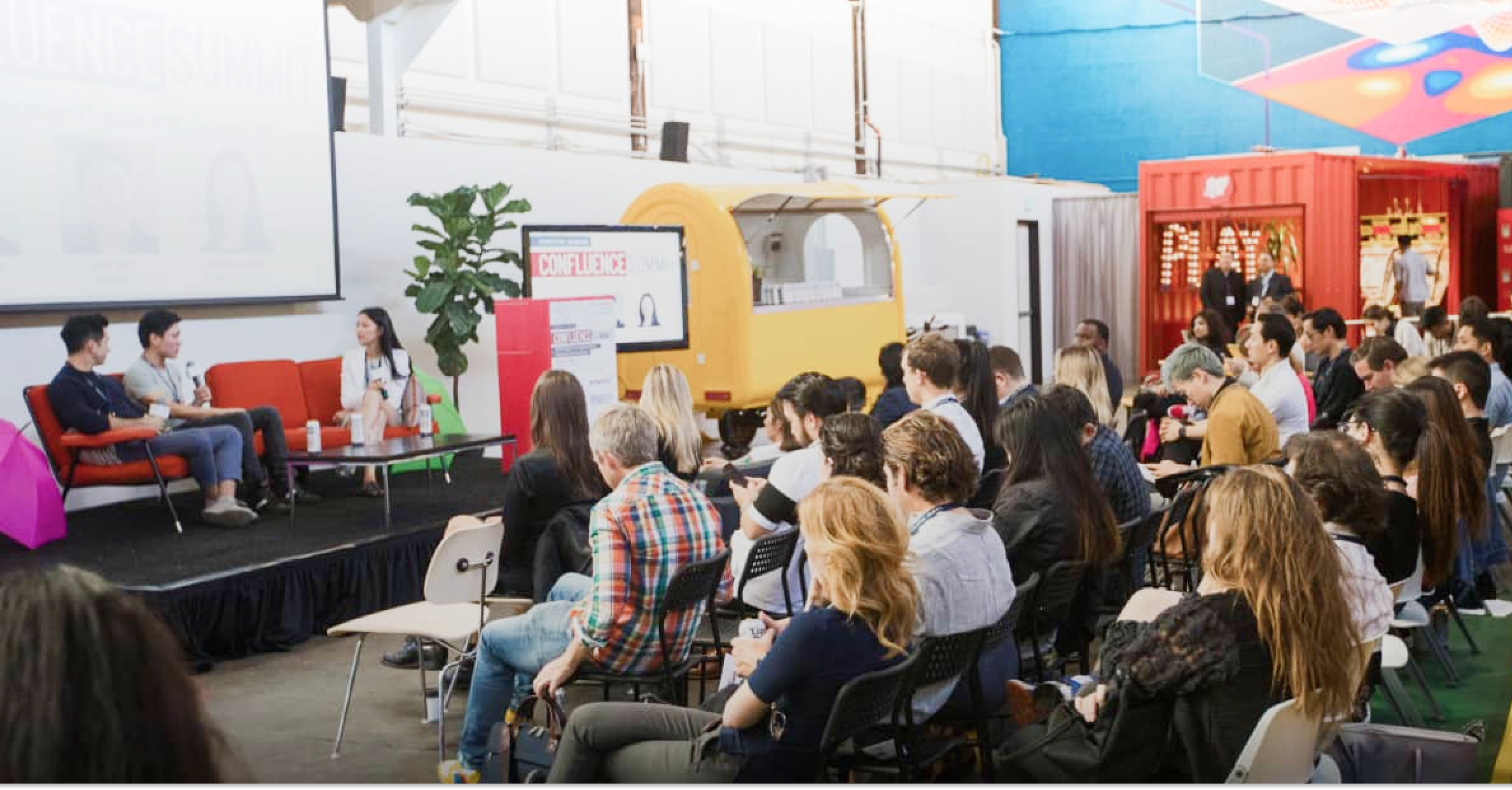 people in audience and on stage at an event