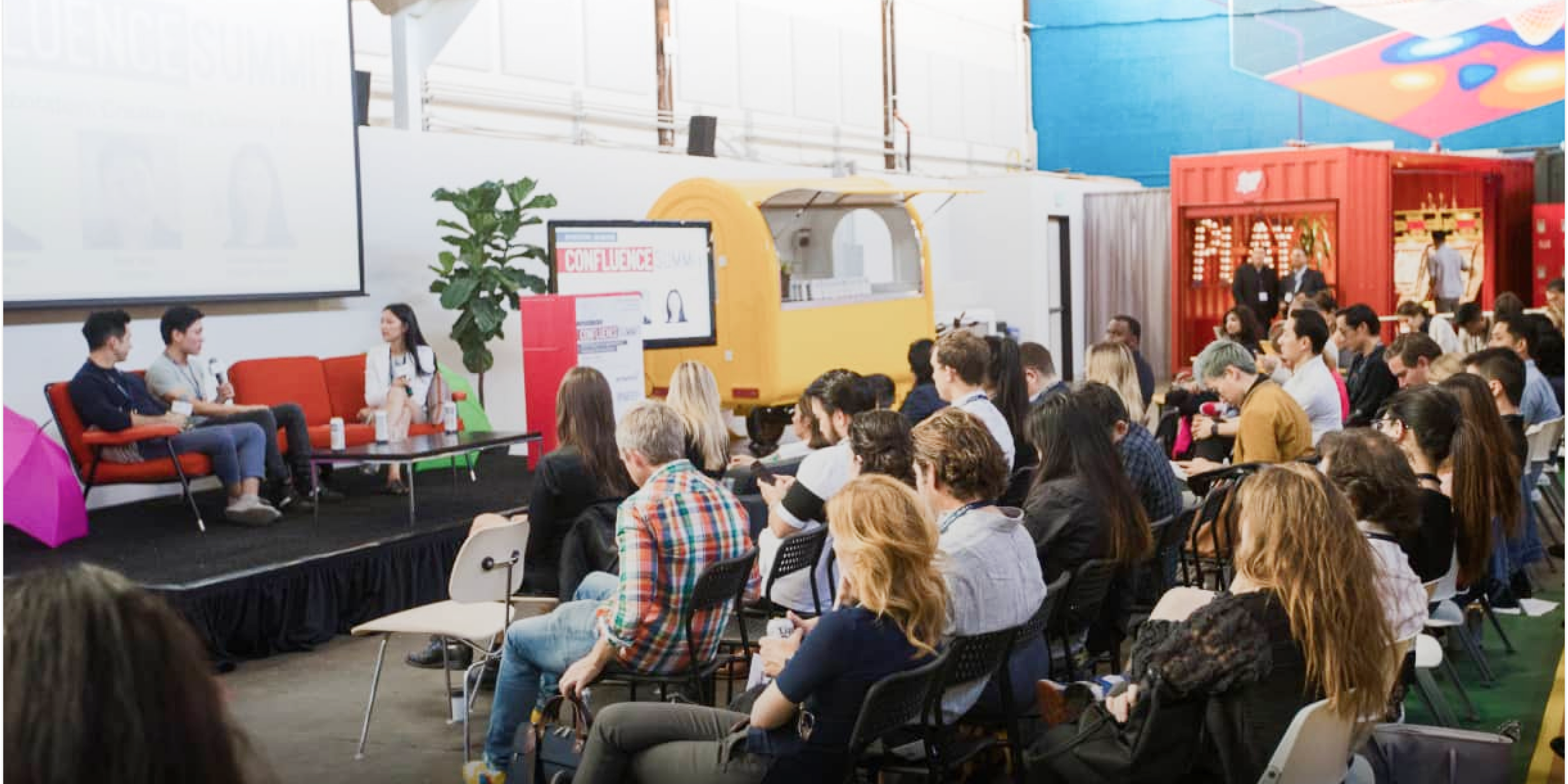 people in audience and on stage at an event