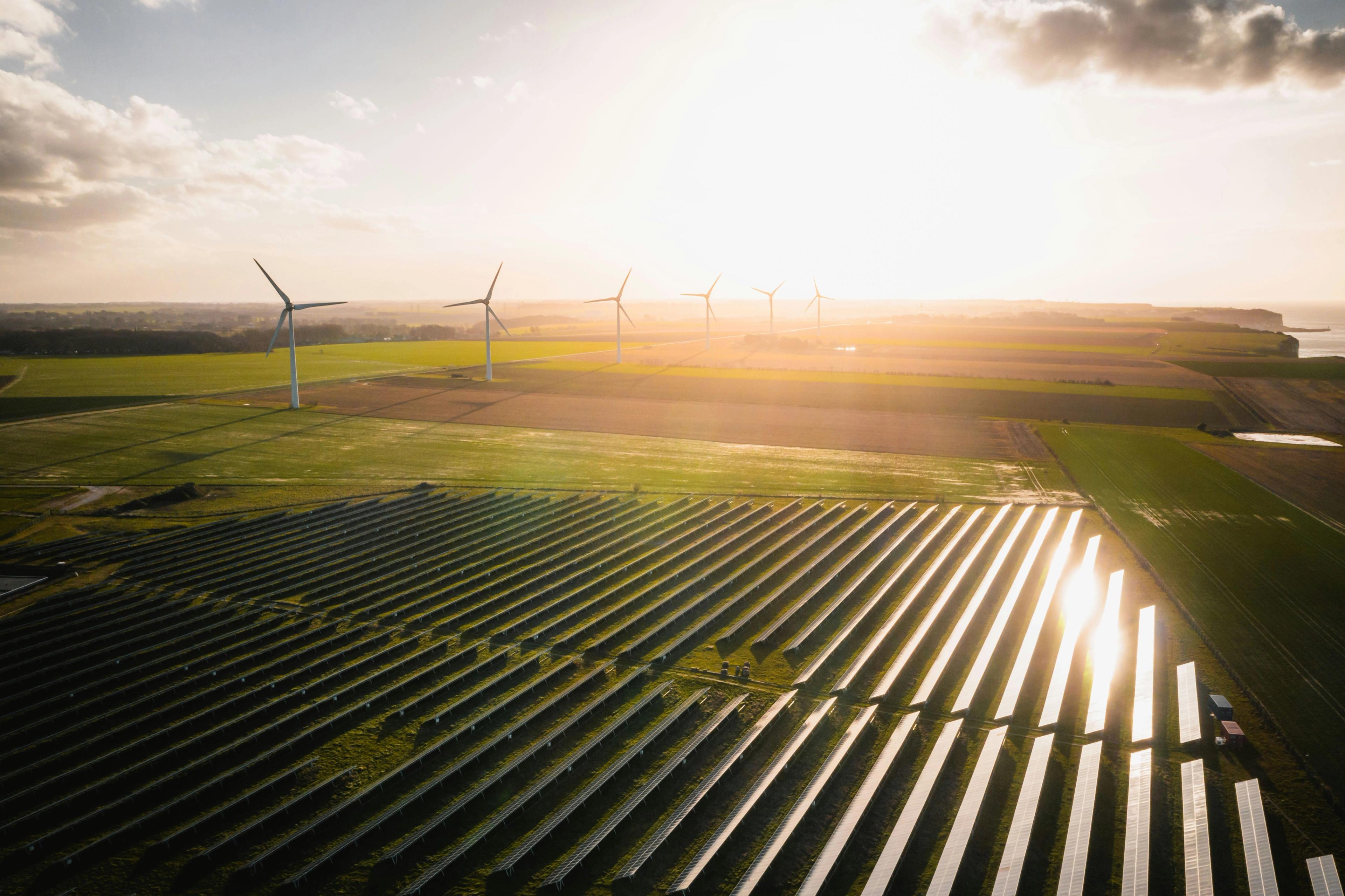 Solar panels and windmills in farmland