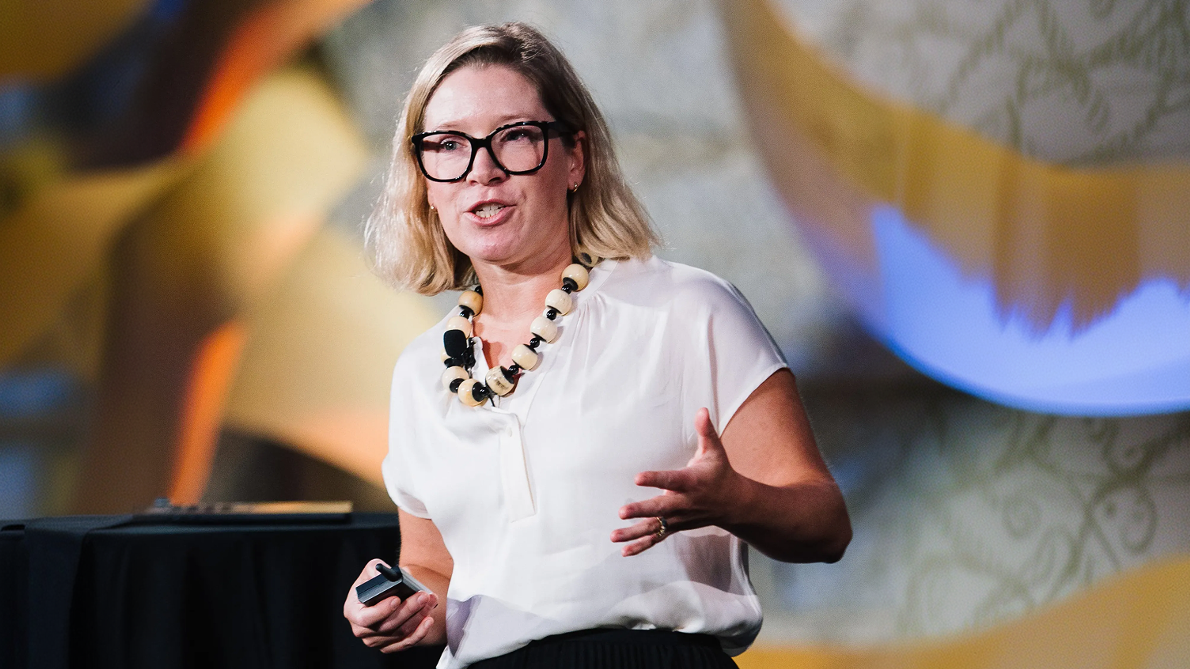 Anna Yates, Corporate EHS & Sustainability at Albany International, speaking on stage