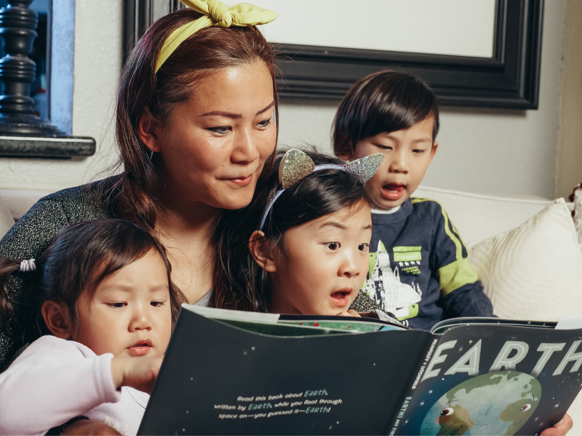 Singaporean Family reading a book together