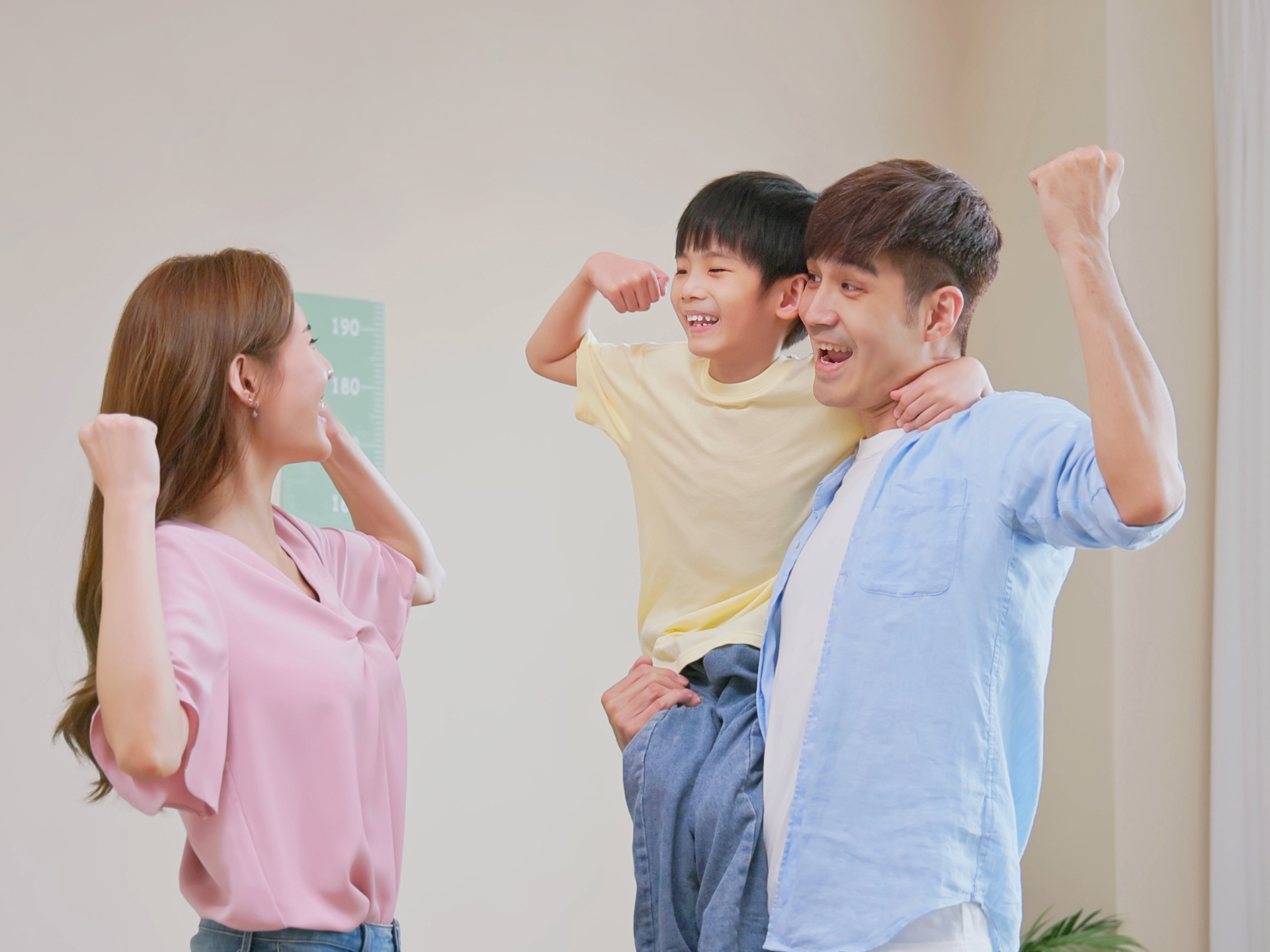 Parents carrying kid