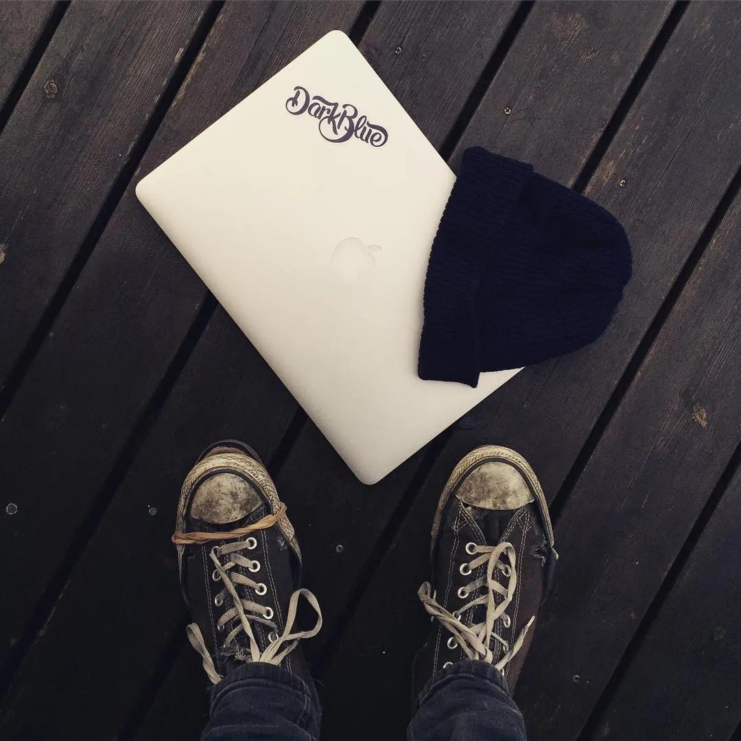 A laptop with a Dark Blue sticker