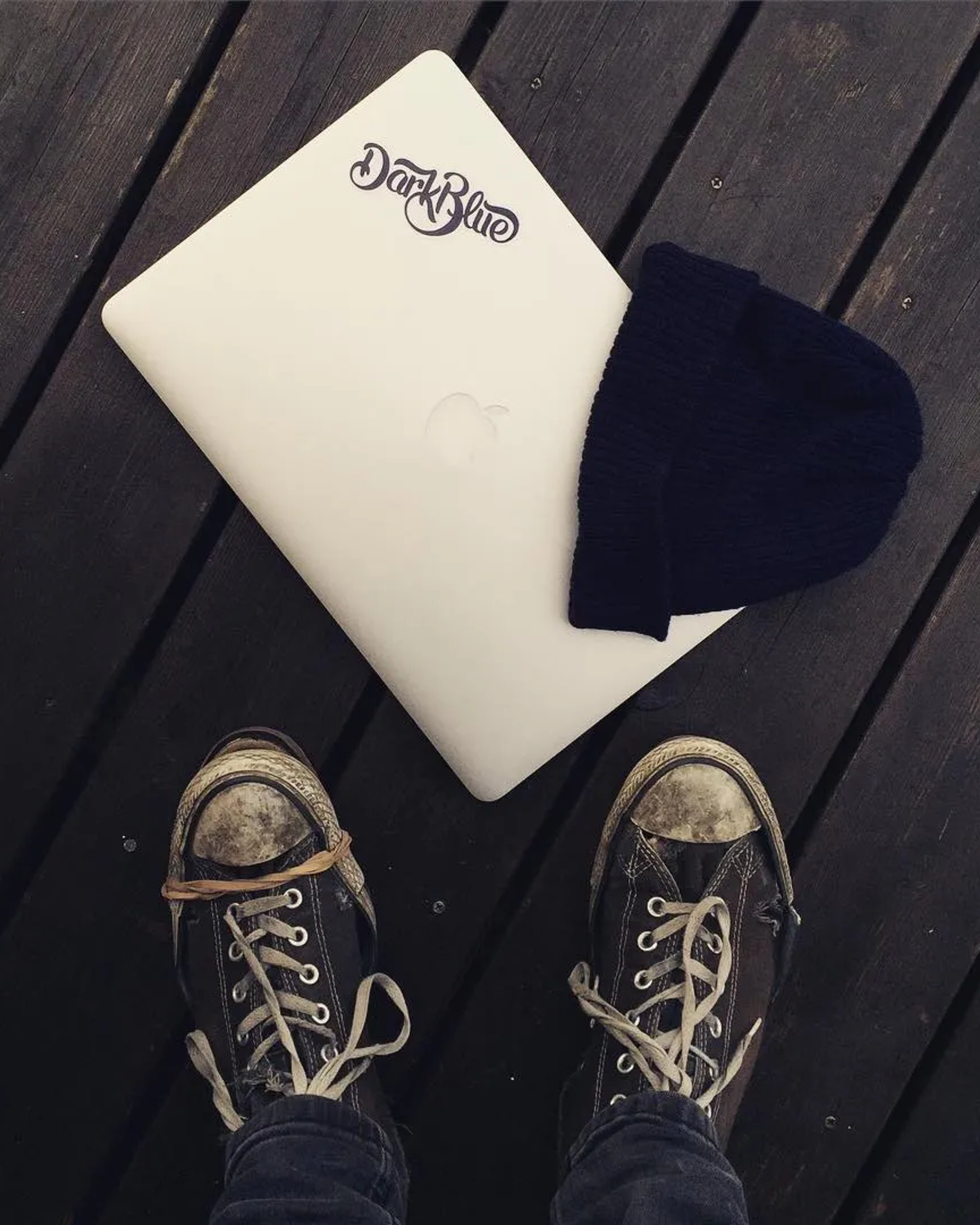 A laptop with a Dark Blue sticker