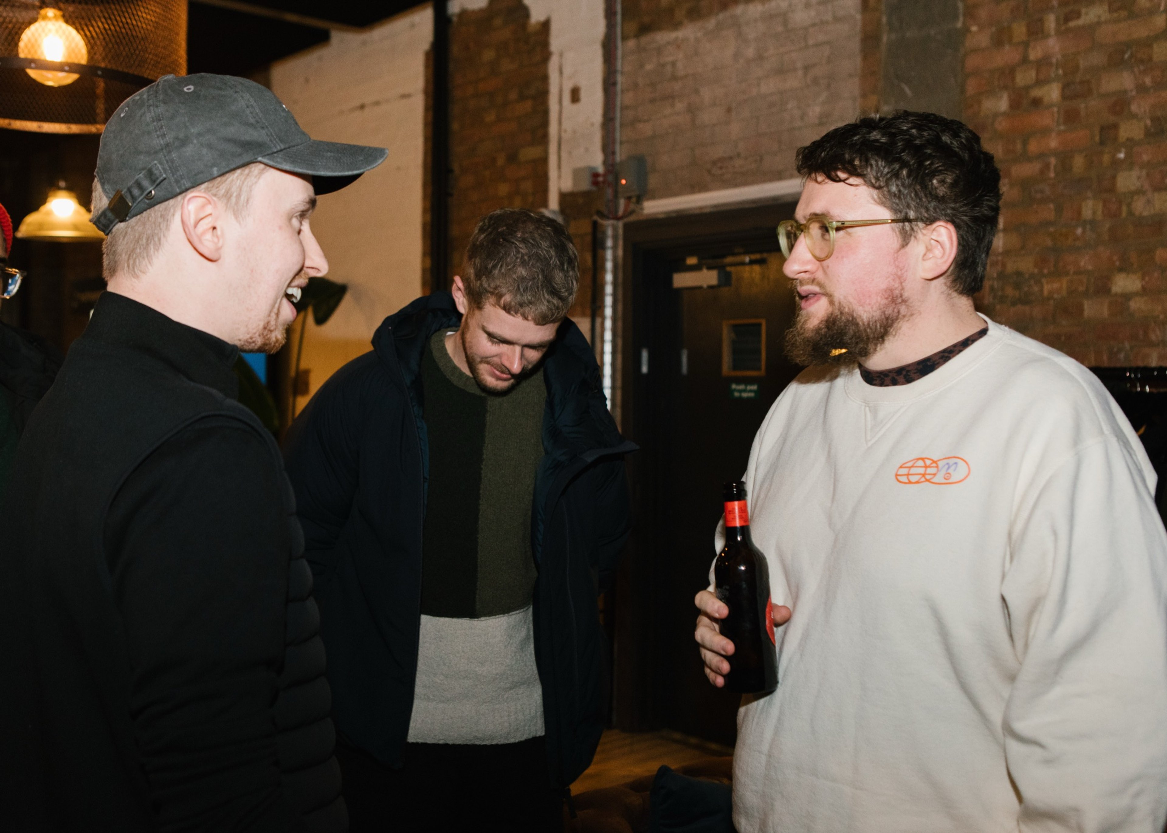 Guests chatting over drinks after the talks
