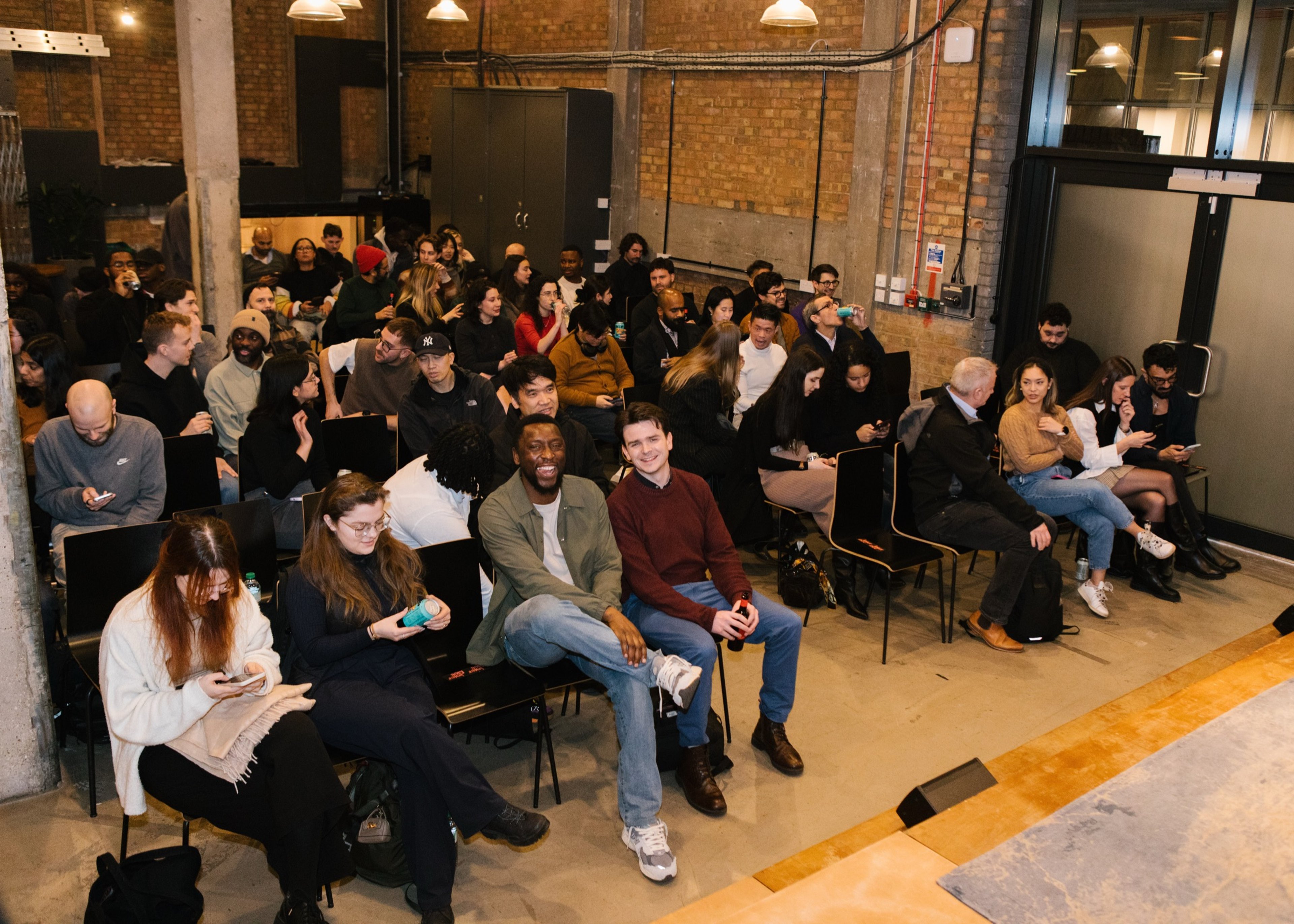 A seated audience waiting for the talks to begin