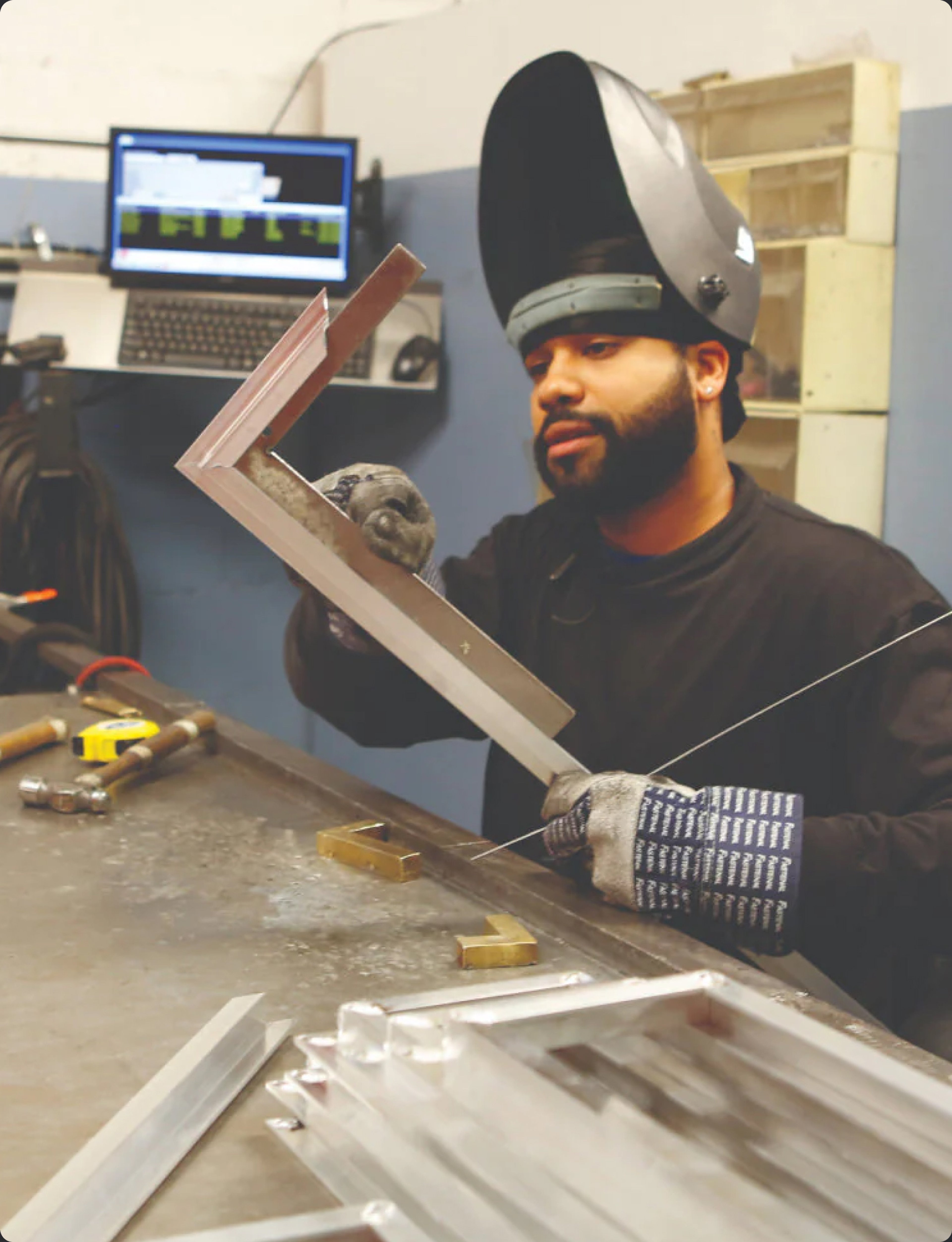A metalworker at the Arch Grille workshop in Brooklyn
