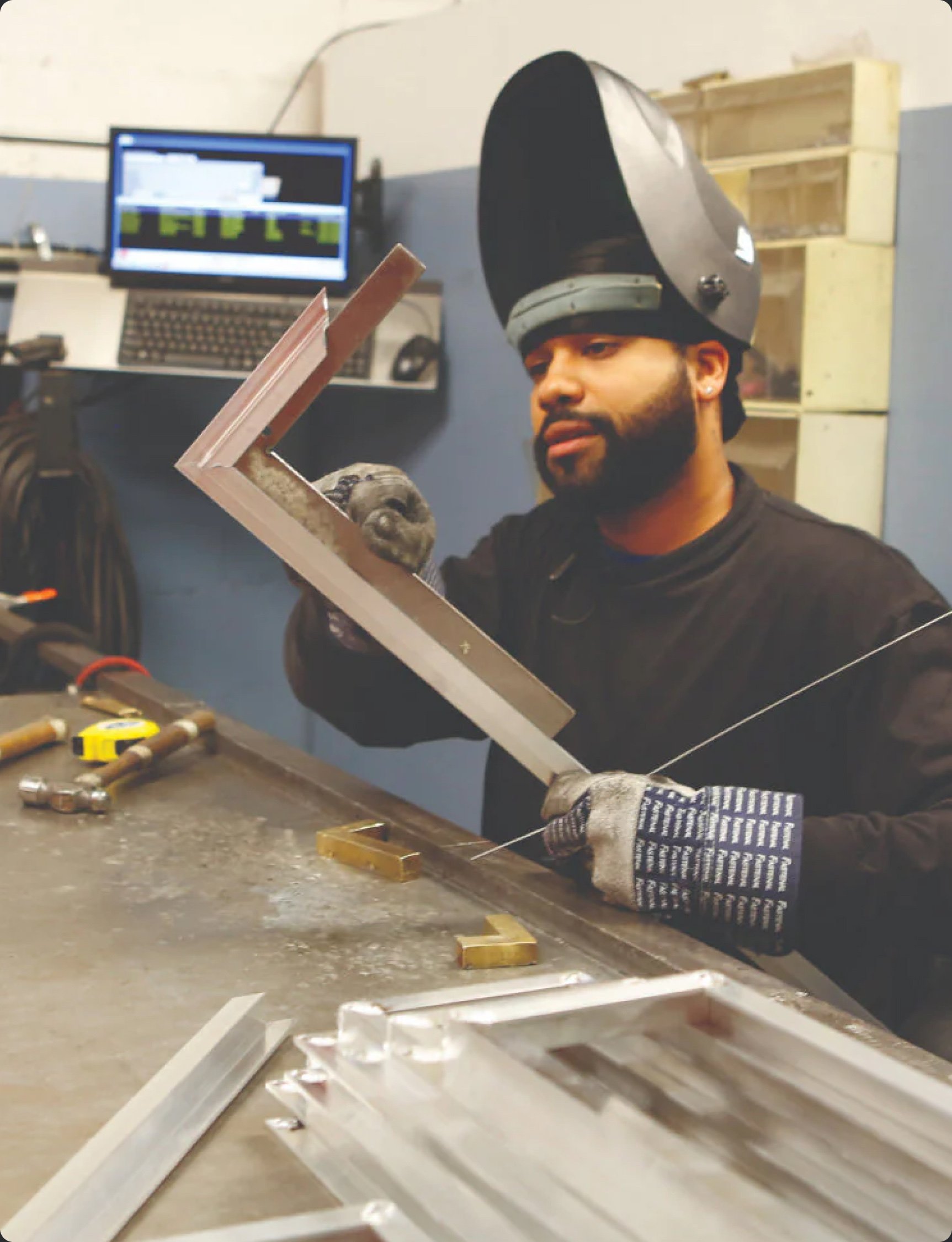 A metalworker at the Arch Grille workshop in Brooklyn