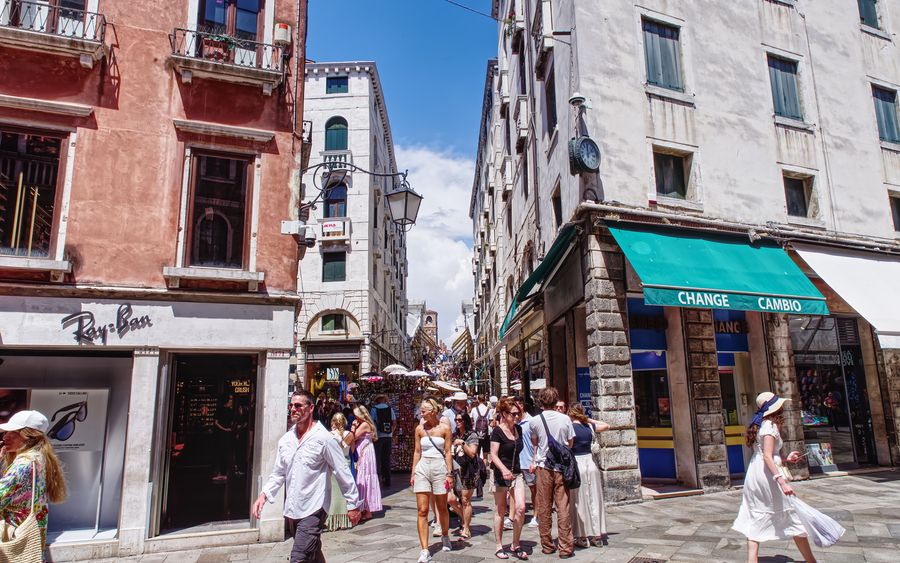 A crowded shopping street full of tourists
