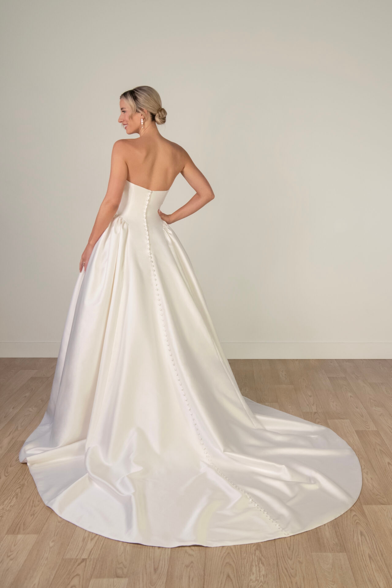 Strapless Mikado Ballgown Wedding Gown with Architectural Seaming and Pockets
