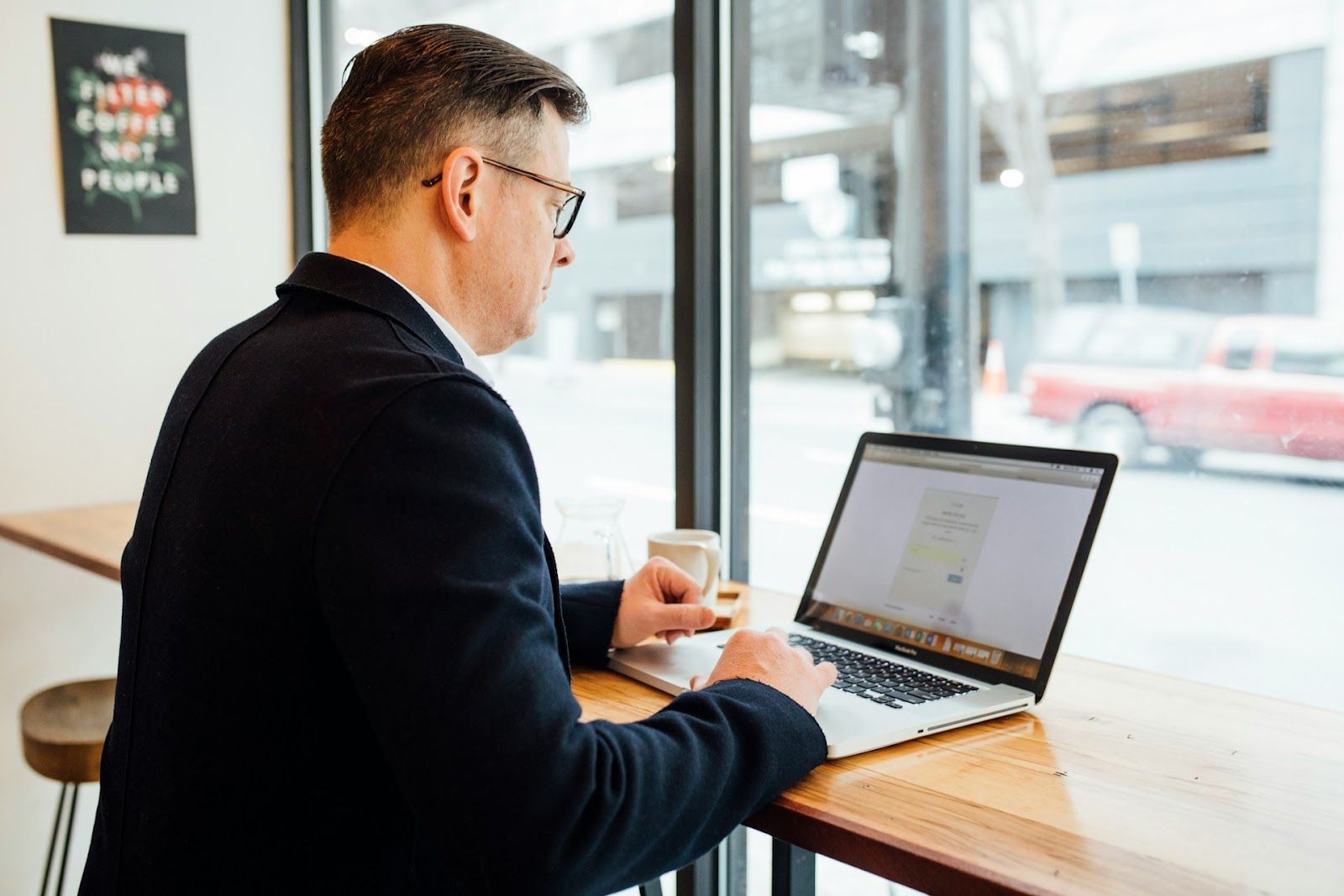 man on laptop selecting an LMS