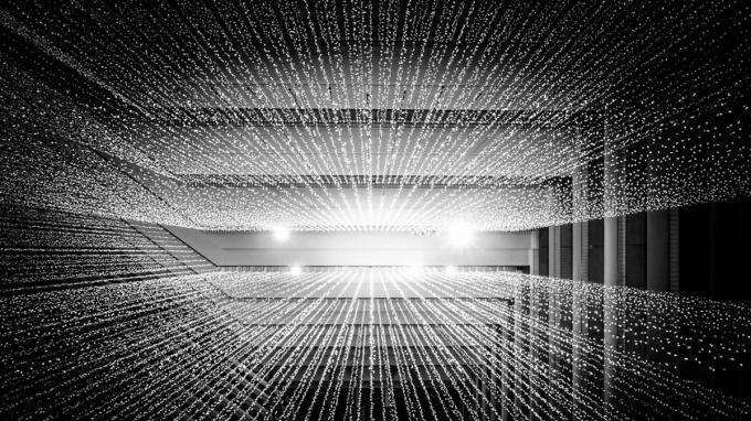 An abstract grid of points of light receding into the distance