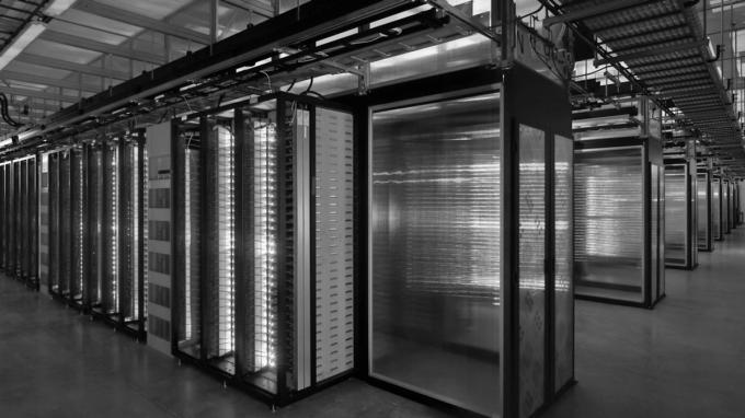 Rows of illuminated servers in a data centre