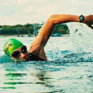 human swimming in open water