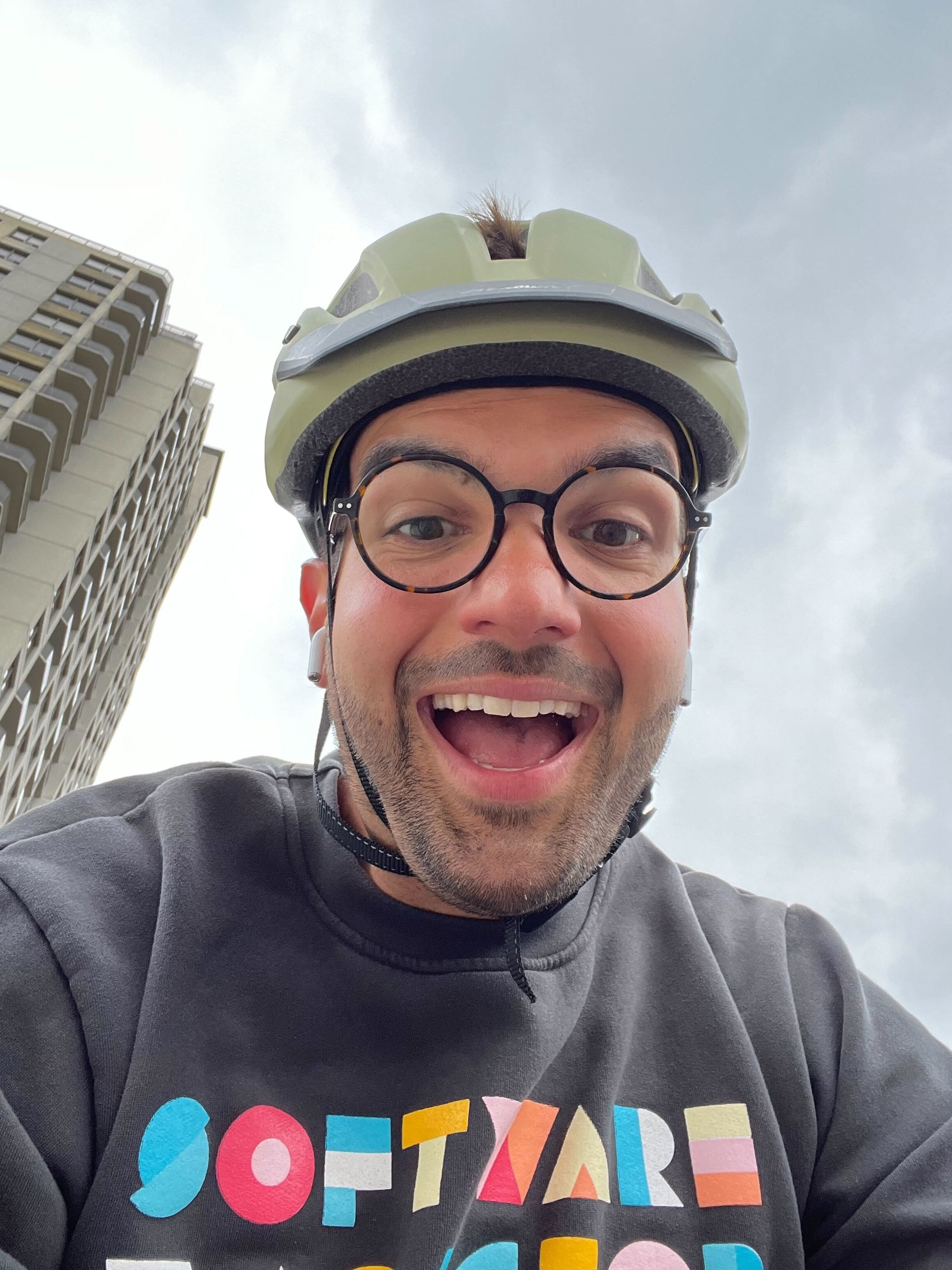 A selfie photo of Jason wearing a helmet riding his bike