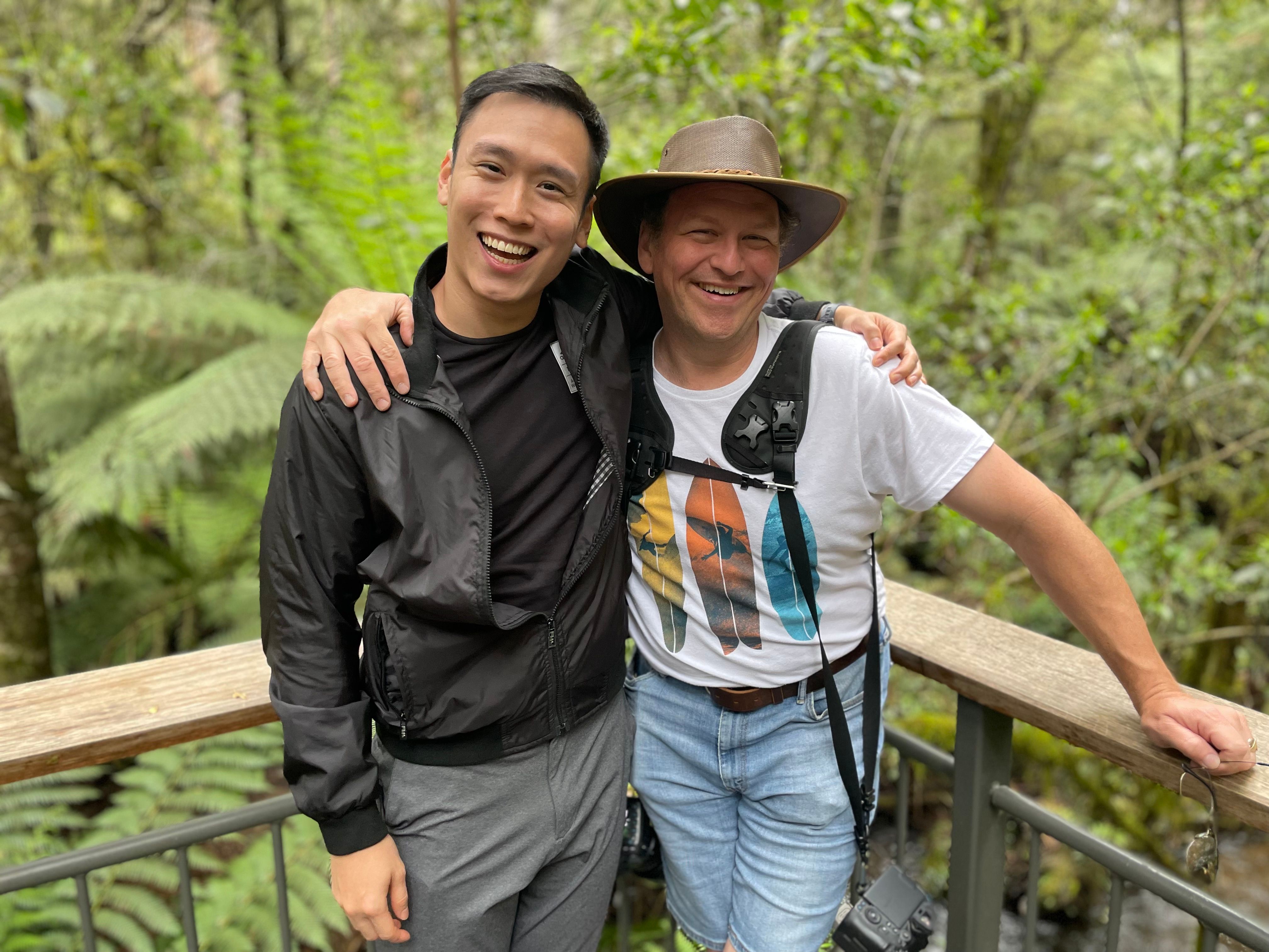 Bill and a colleague posing together on a nature hike in Australia