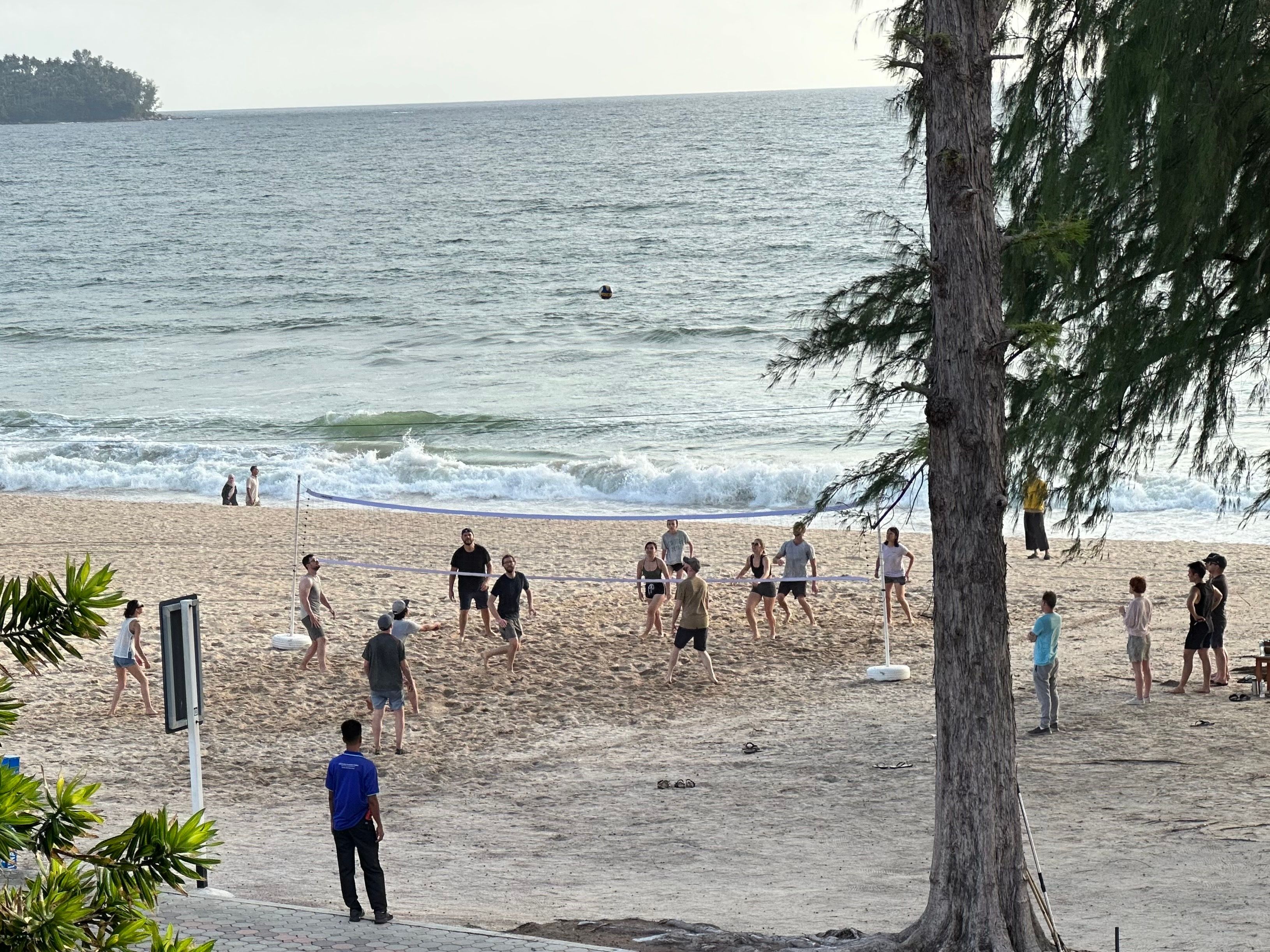 A distant shot of the Cliniko beach volleyball teams playing a practice match 