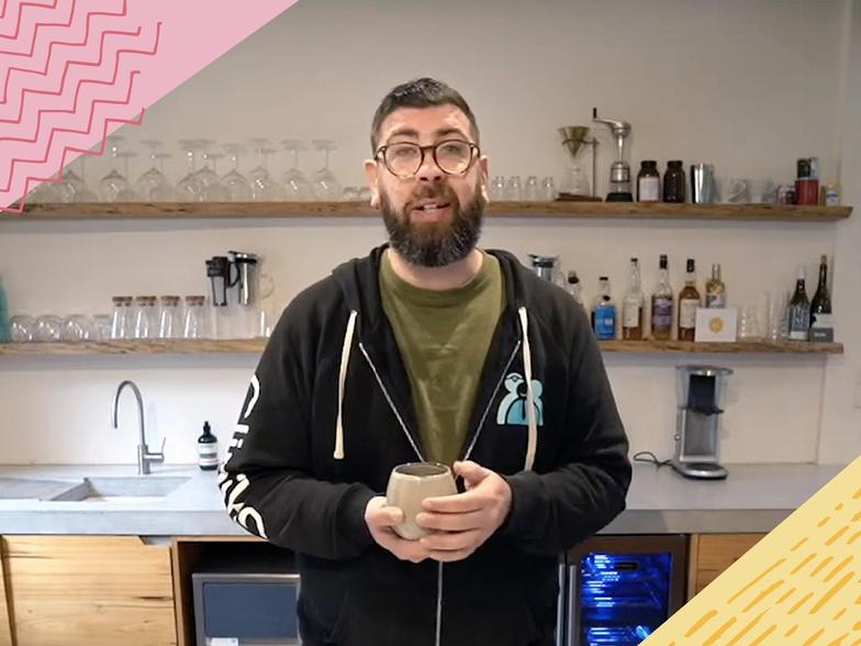Joel standing at his home coffee bar answering questions from Cliniko and Coffee viewers