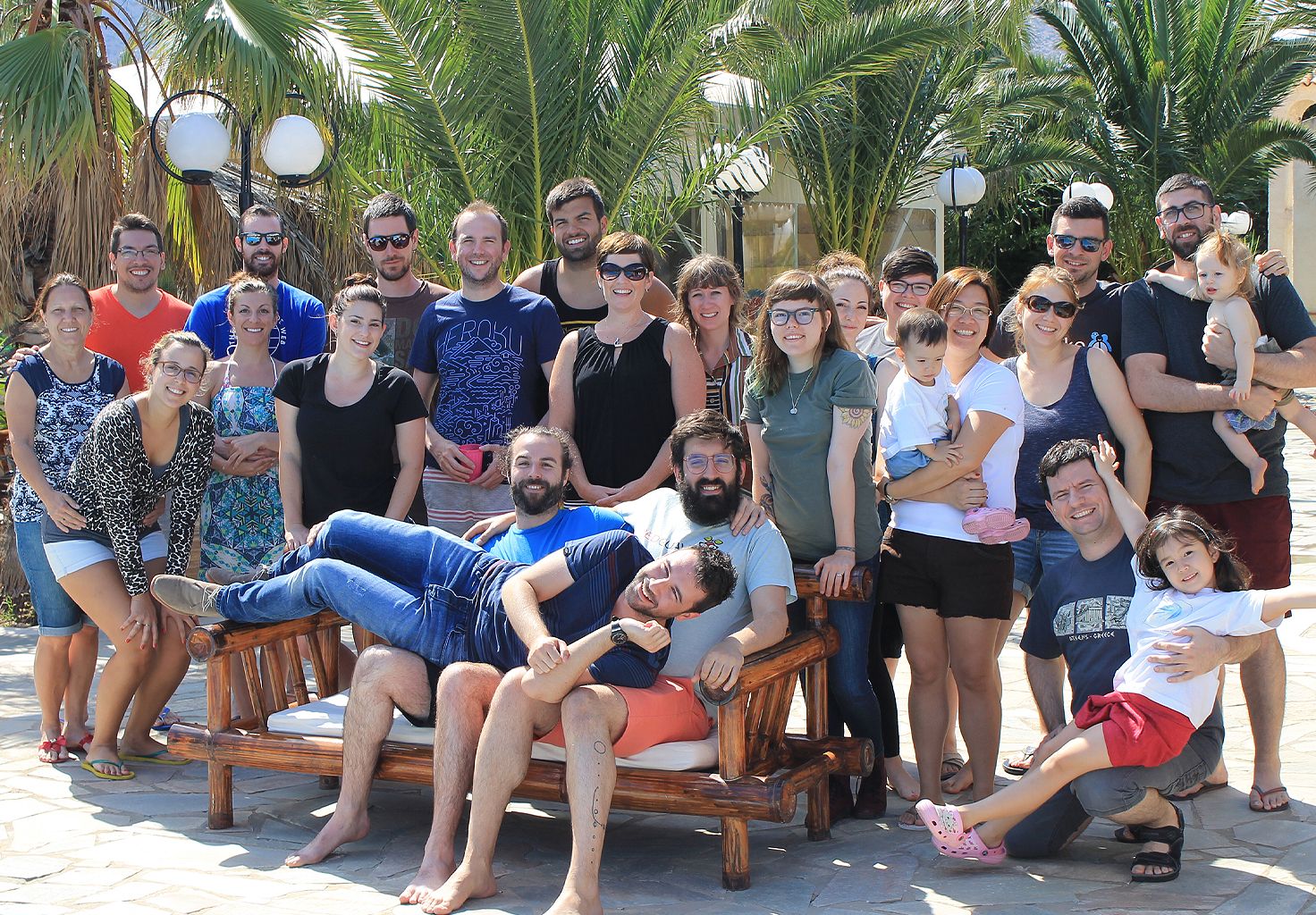 A group photo of the Cliniko team and family members in Greece.