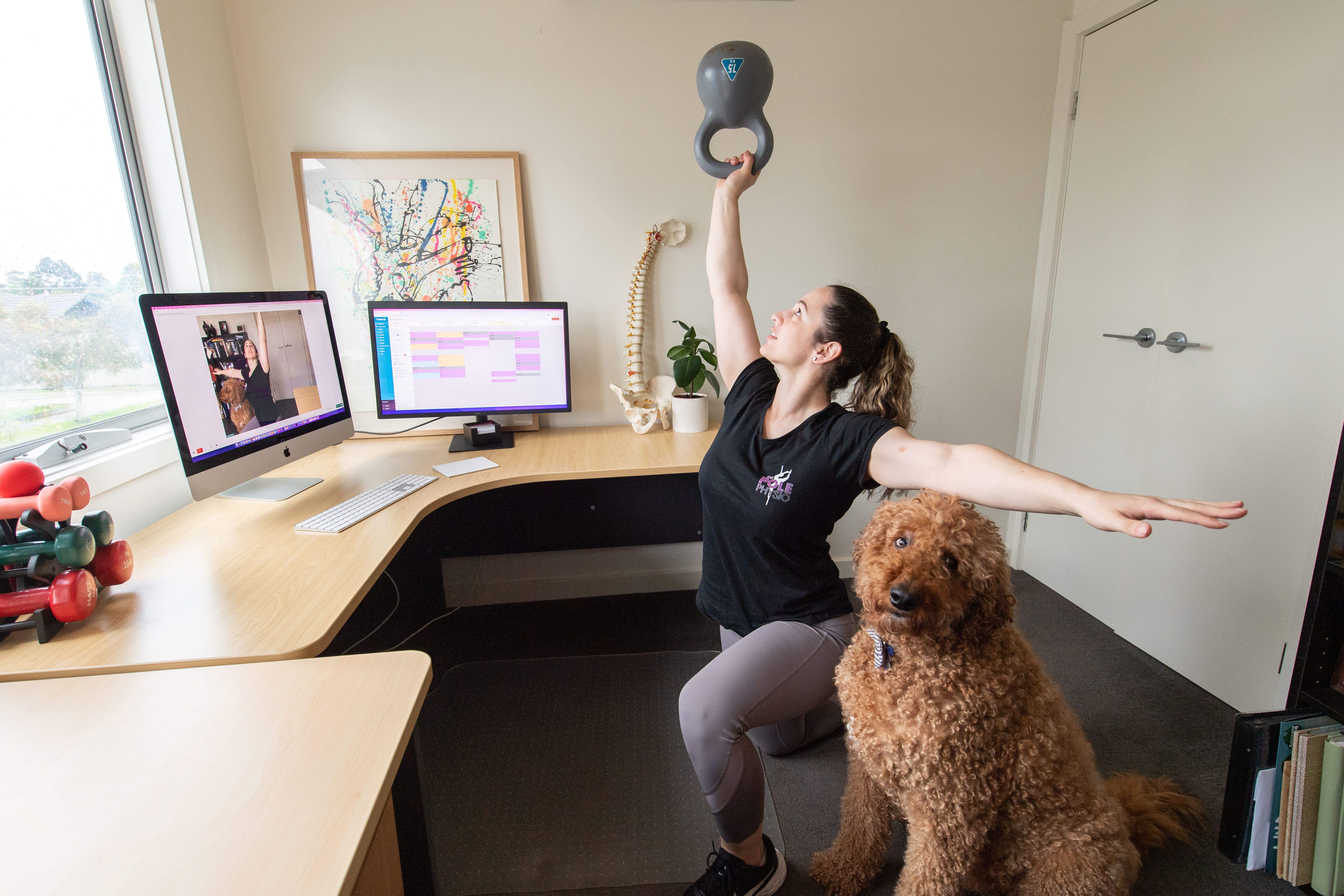 The Pole Physio Simone Muscat in her home practice with her dog, Theo.