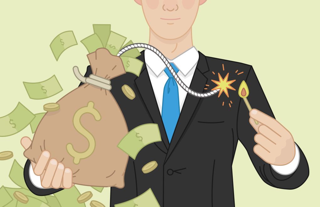 Man in a business suit lighting a fuse to a bag of money