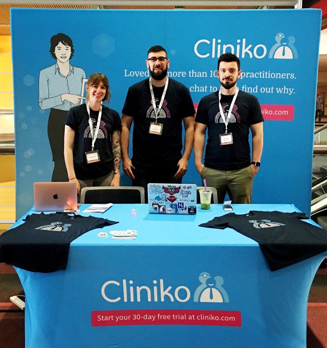 Part of the Cliniko team at a conference booth