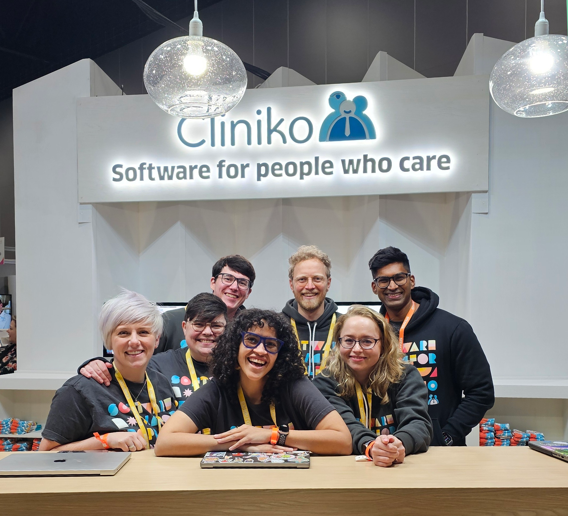 The team posing in front of the Cliniko stand at The Foot and Ankle Show 2024