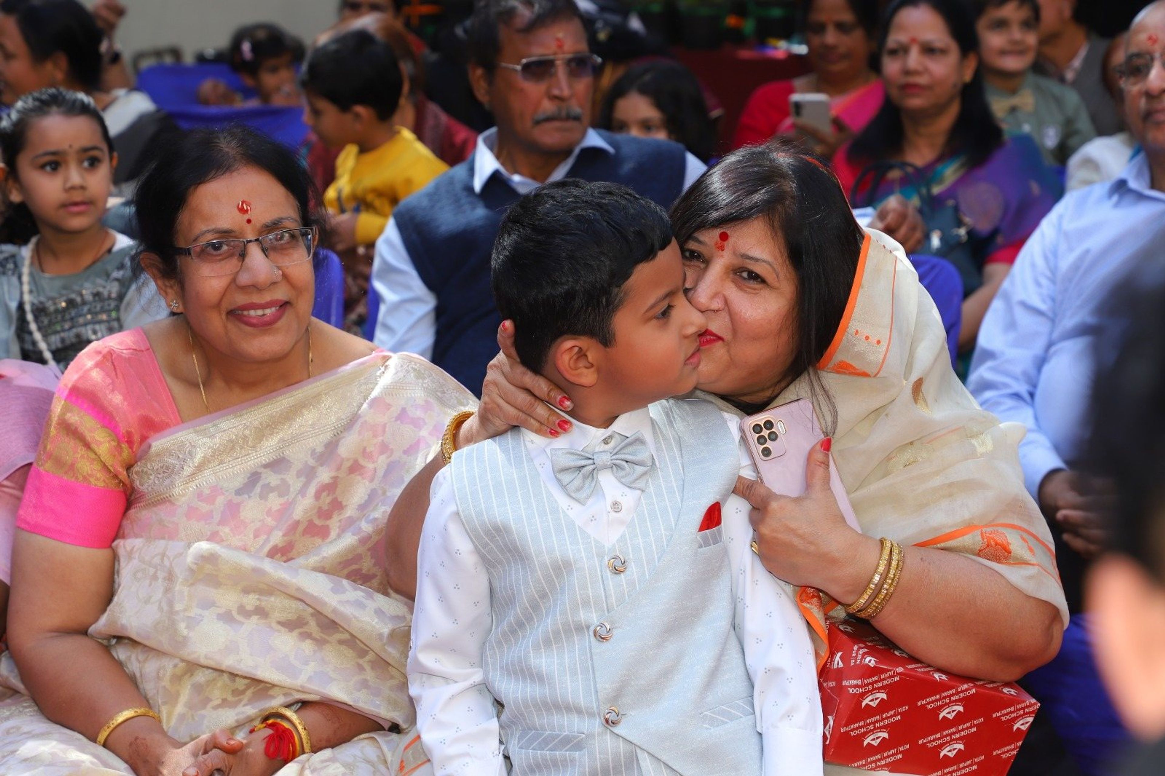 A grandmother hugging her grandson at Grandparents' Day