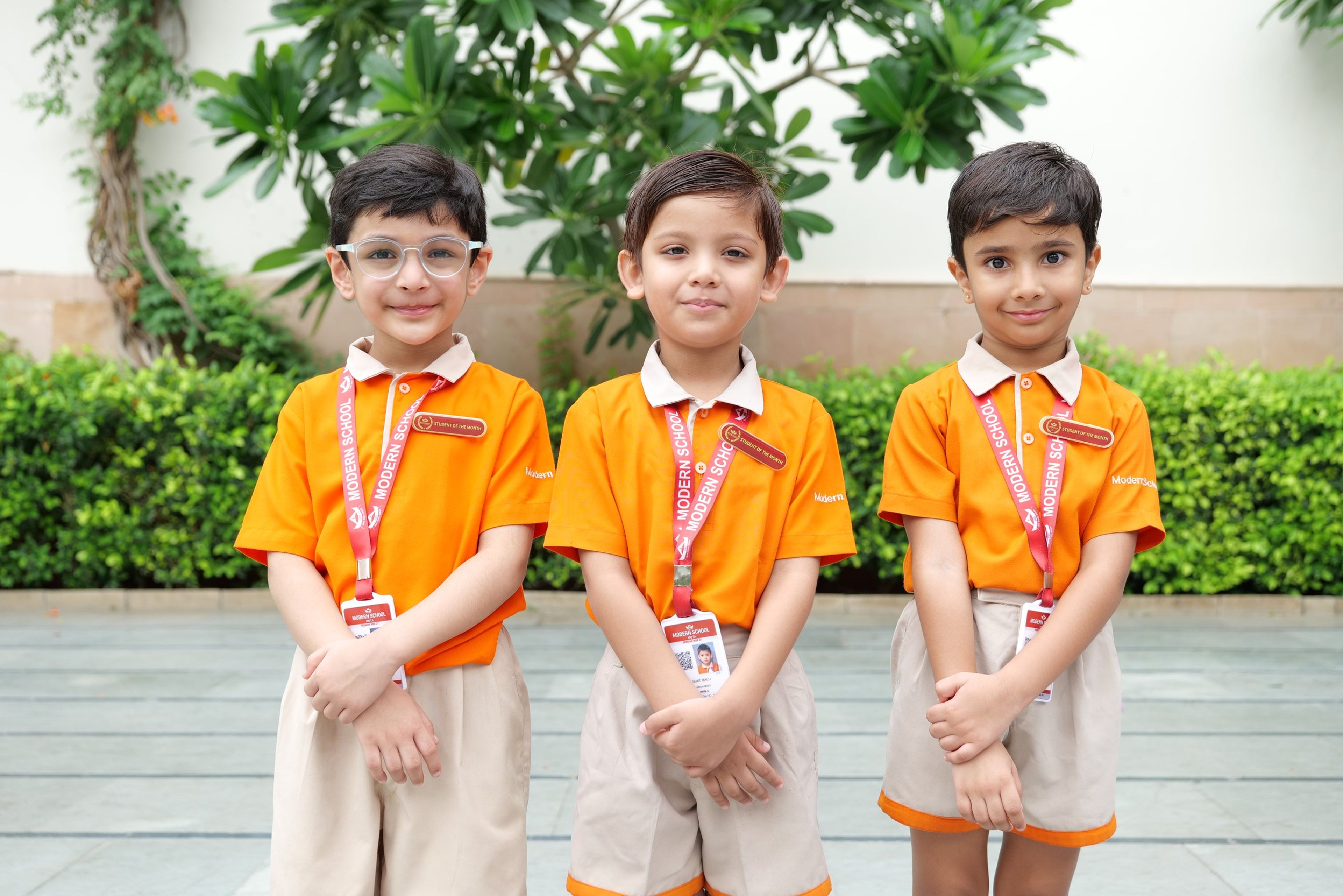 Three pre-primary boys in the summer uniform