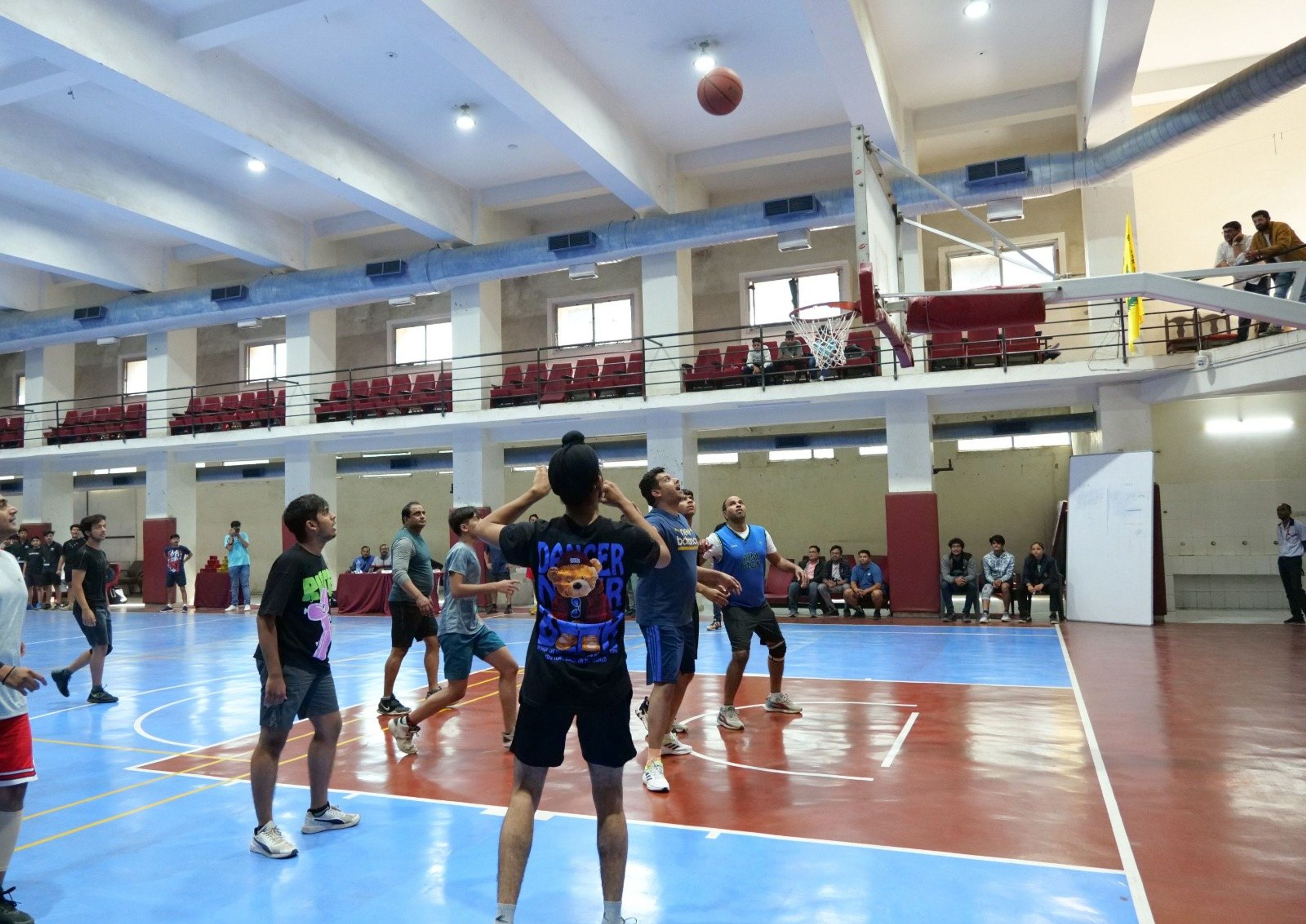 A basketball game on the indoor court