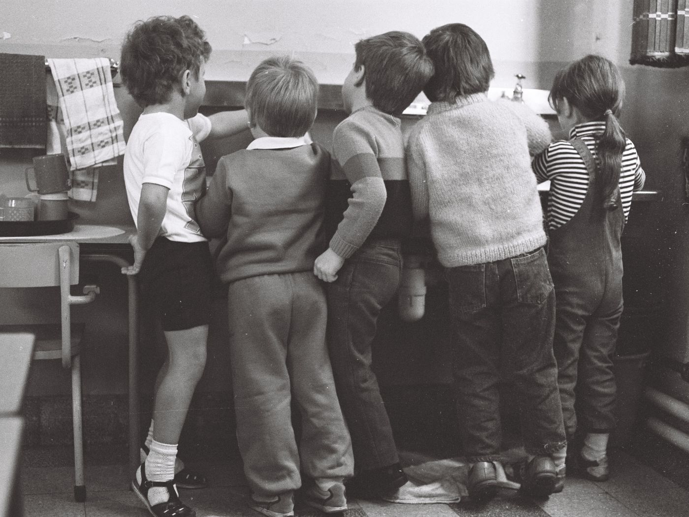 Archival black-and-white photograph of children in a classroom