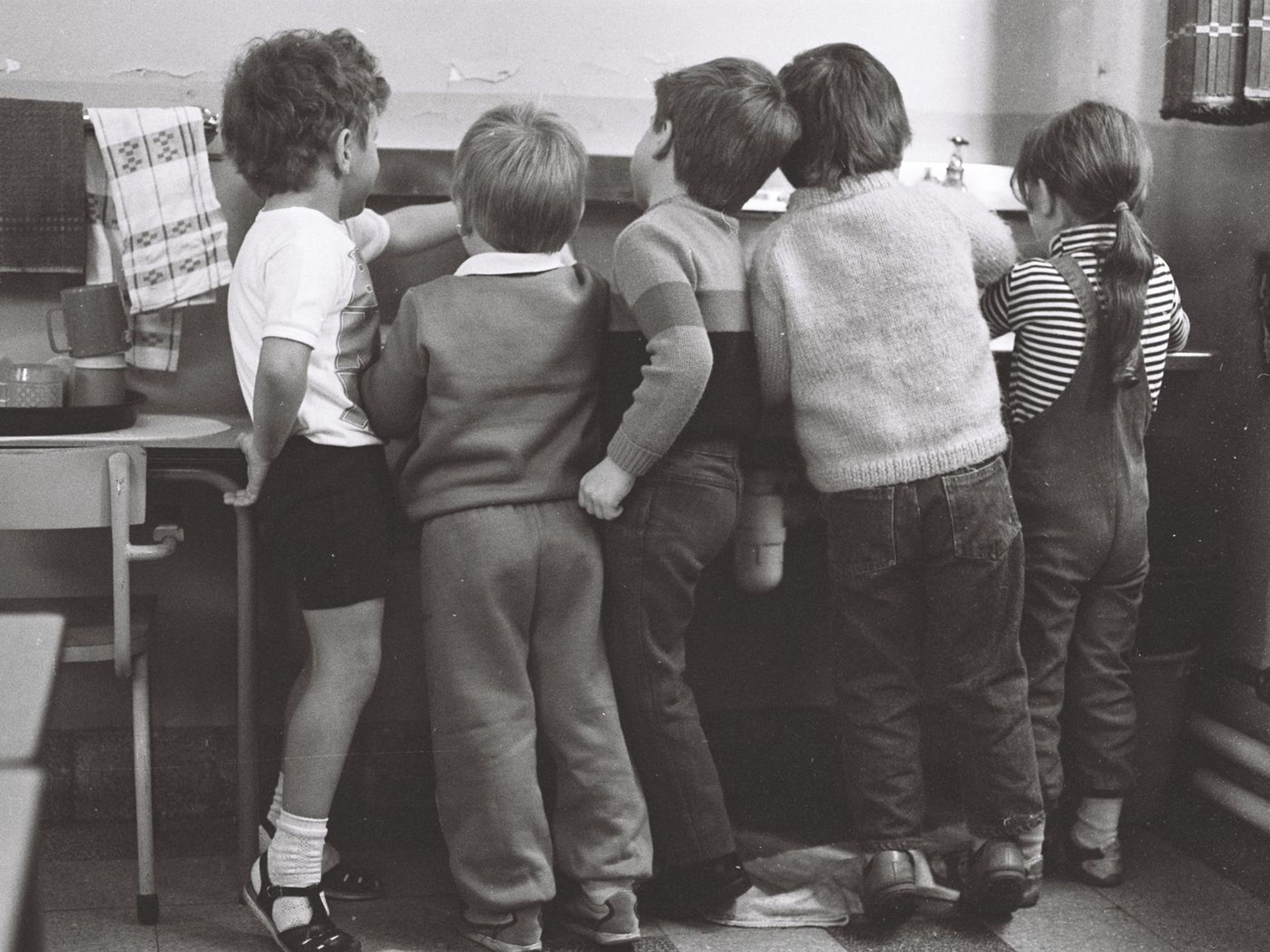 Archival black-and-white photograph of children in a classroom