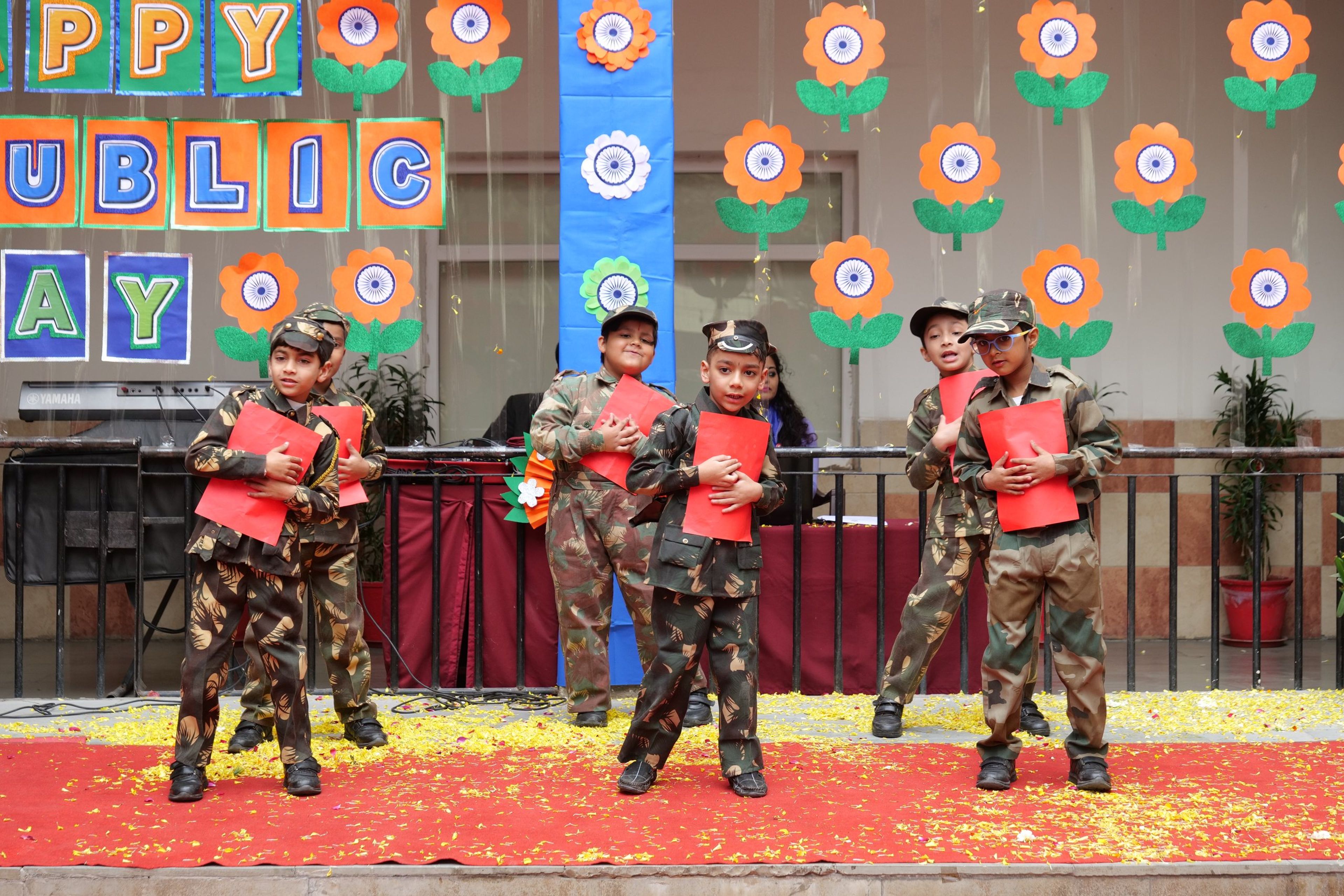 Pupils in army costumes performing for Republic Day