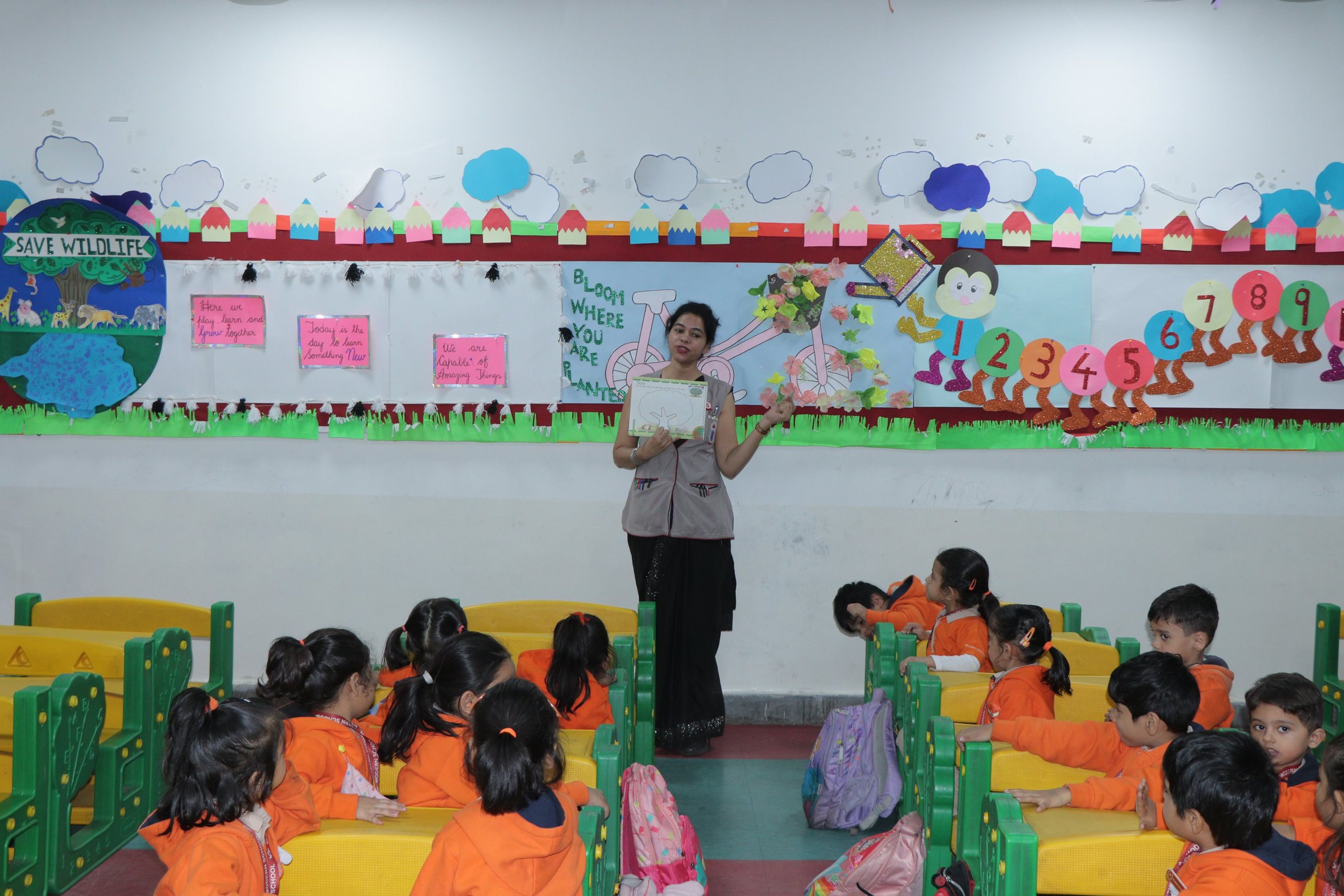 A teacher telling a story to a pre-primary class