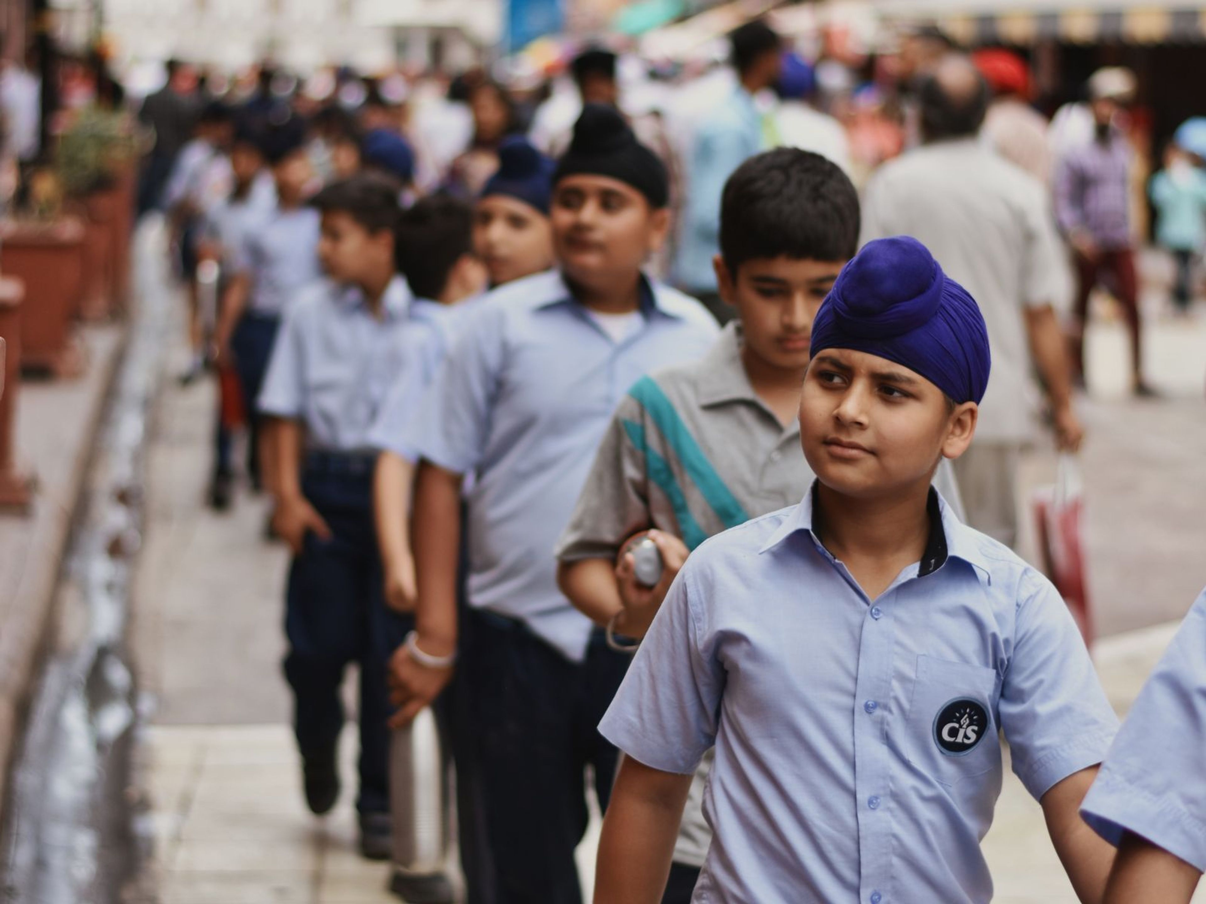 Students in uniform walking together outdoors