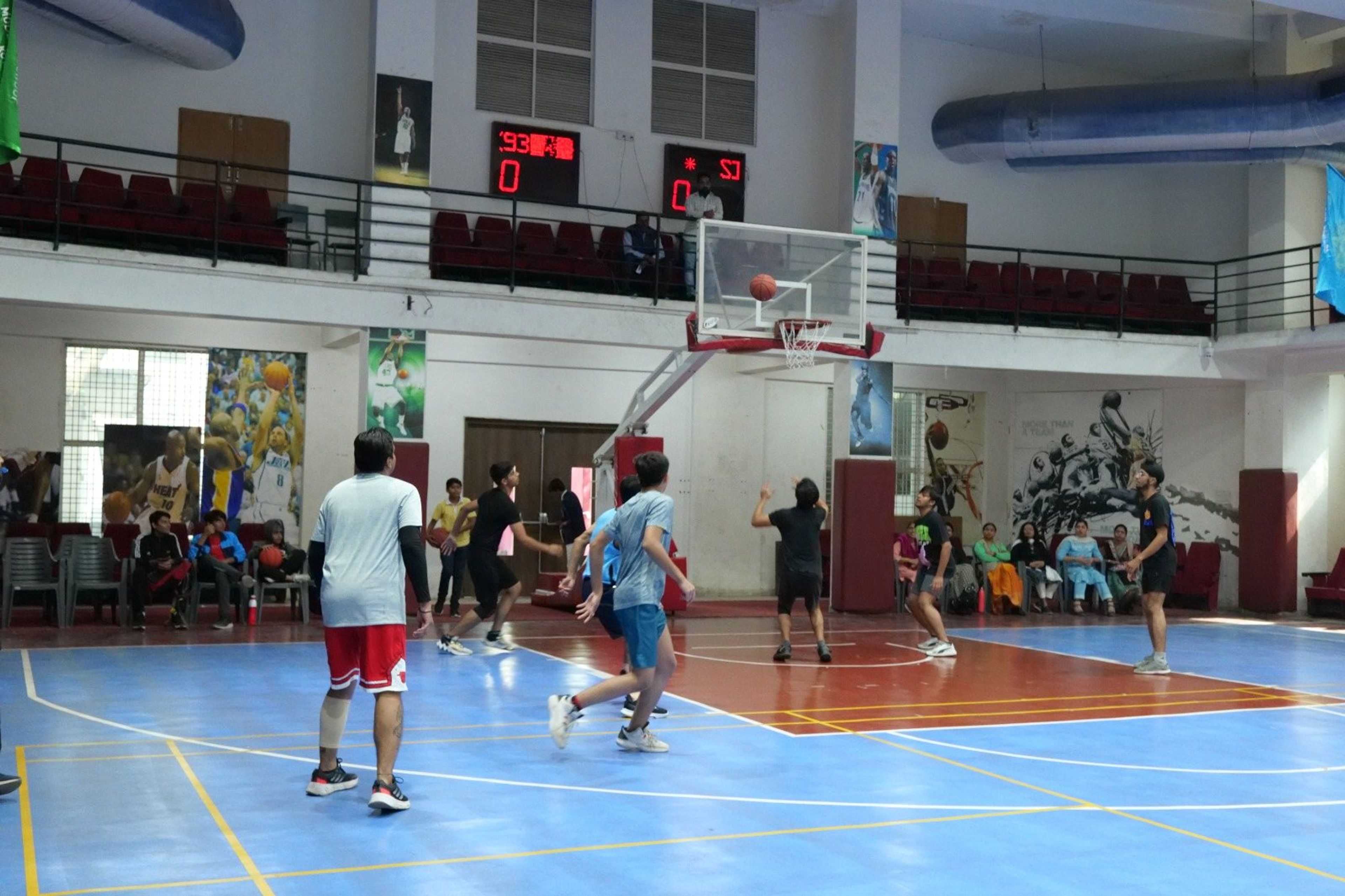 Players on the indoor basketball court